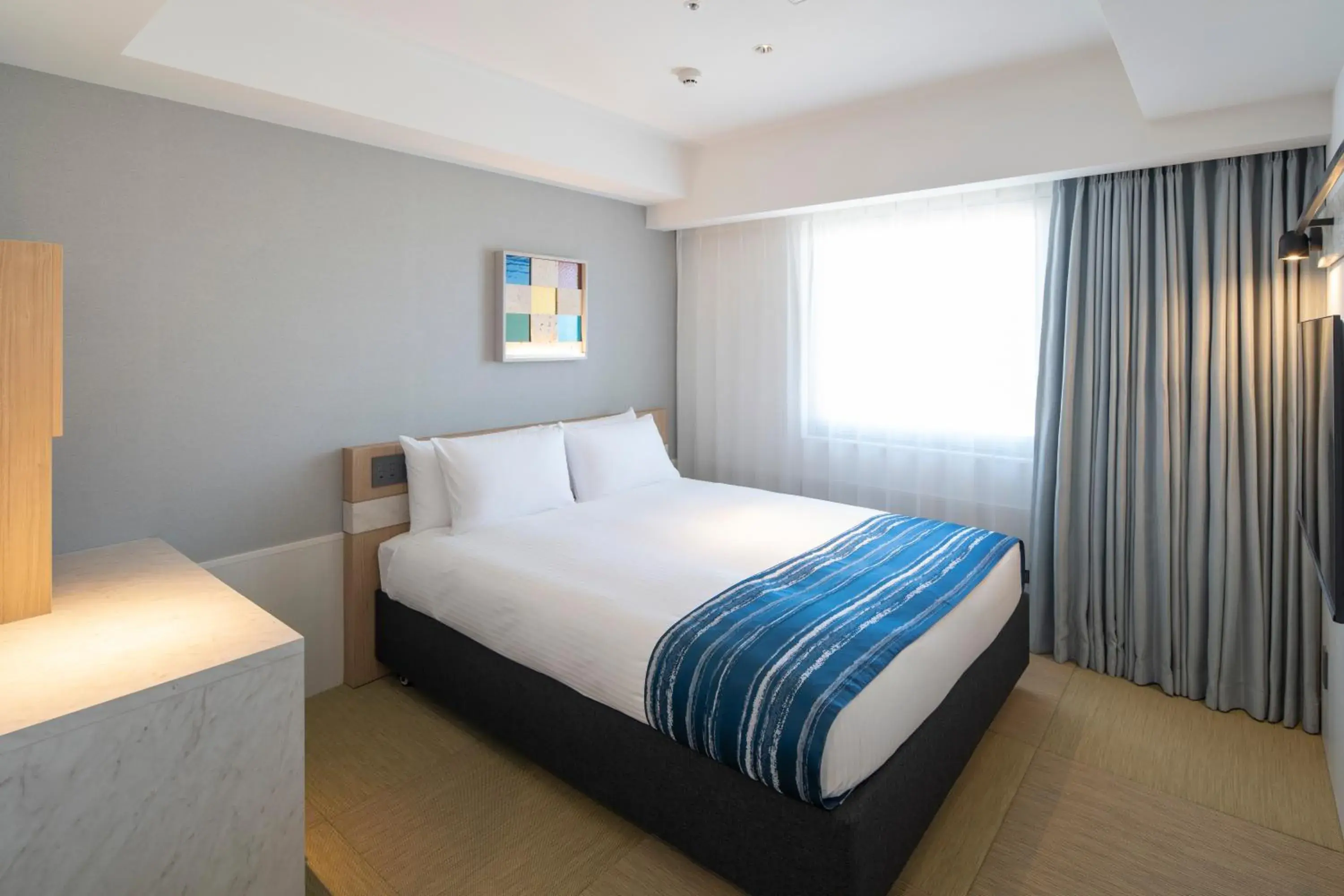 Bed in Okinawa Hinode Resort and Hot Spring Hotel Bed in Okinawa Hinode Resort and Hot Spring Hotel