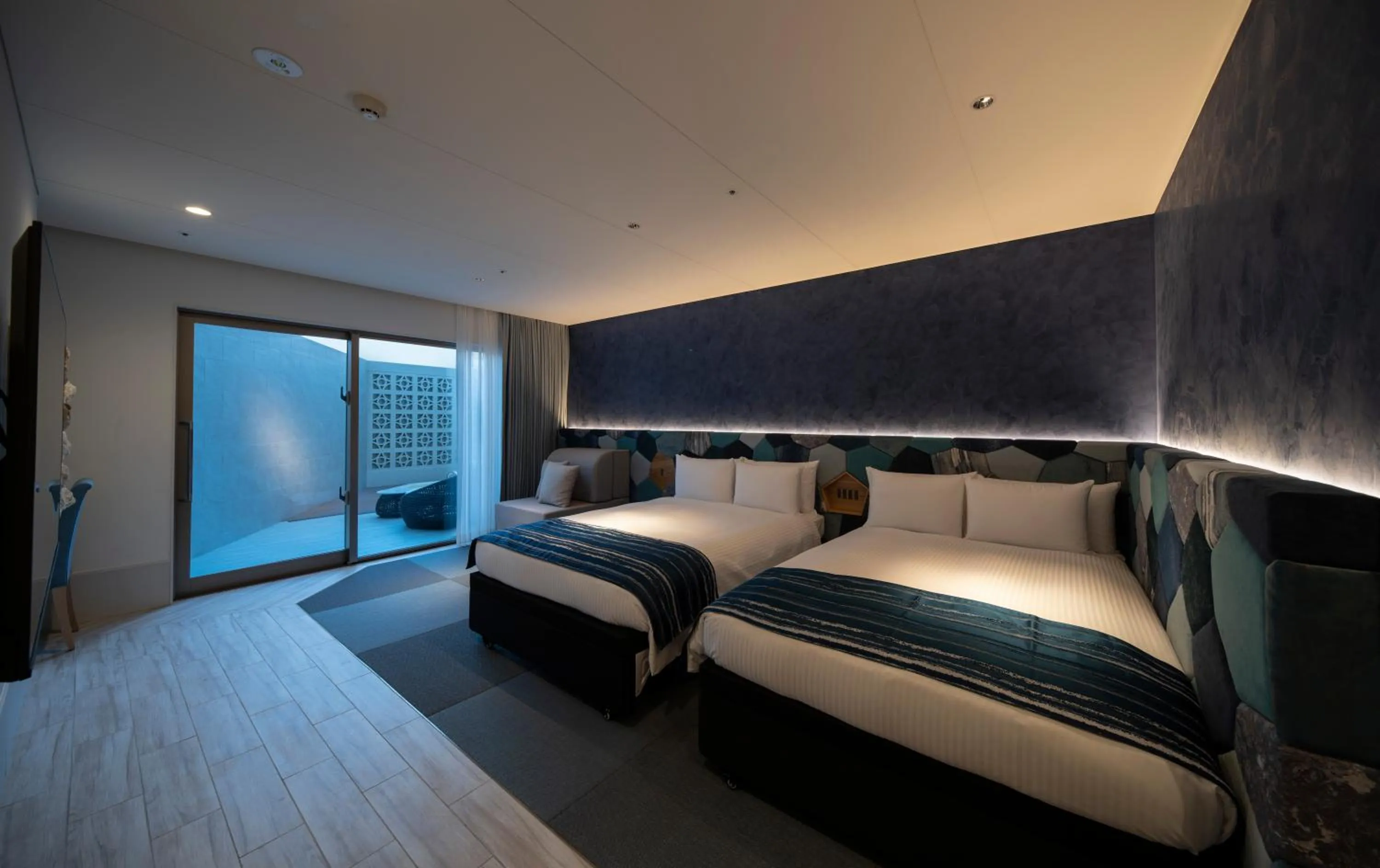 Bedroom, Bed in Okinawa Hinode Resort and Hot Spring Hotel