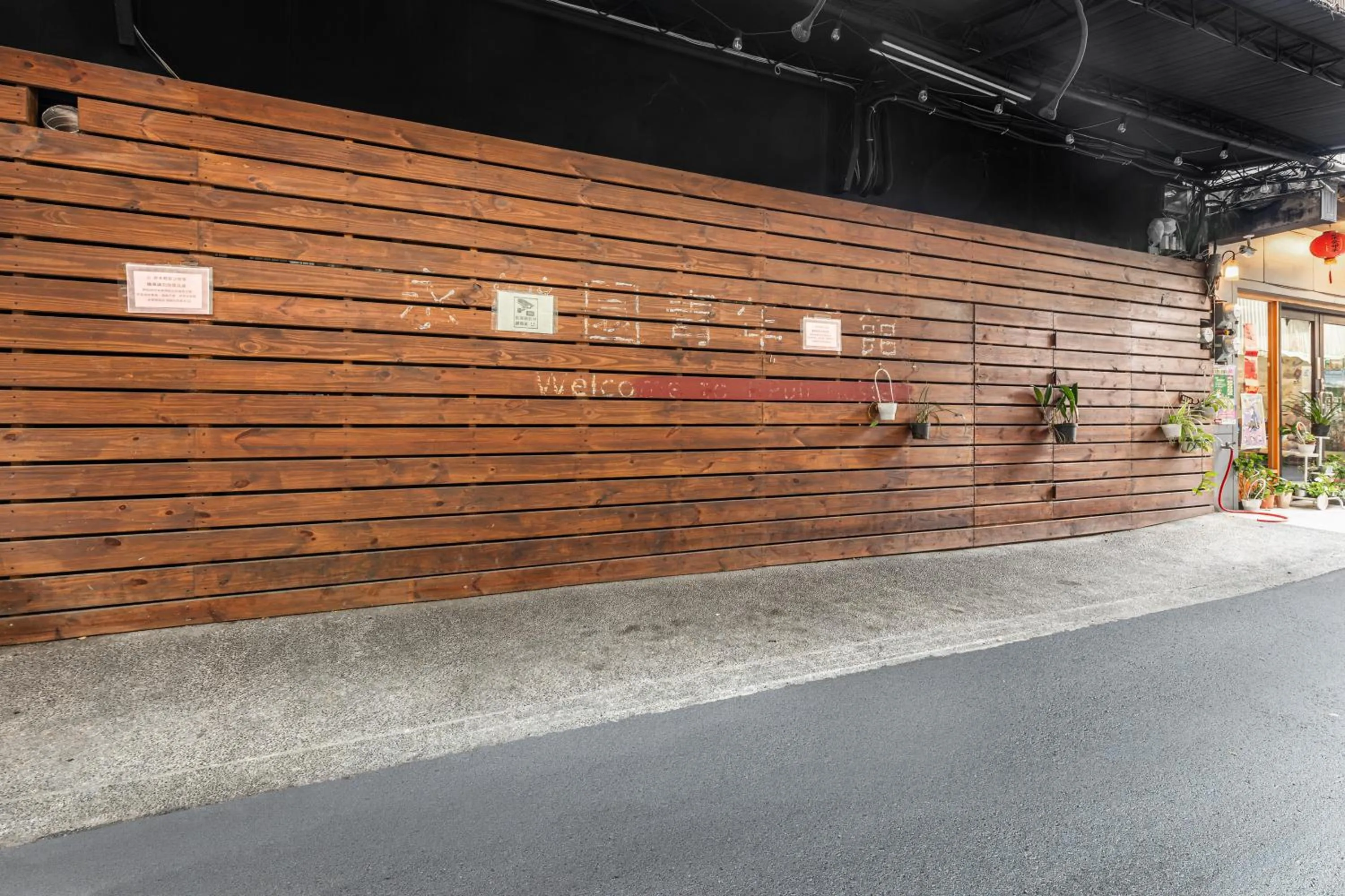 Parking in Forever Happiness Hostel