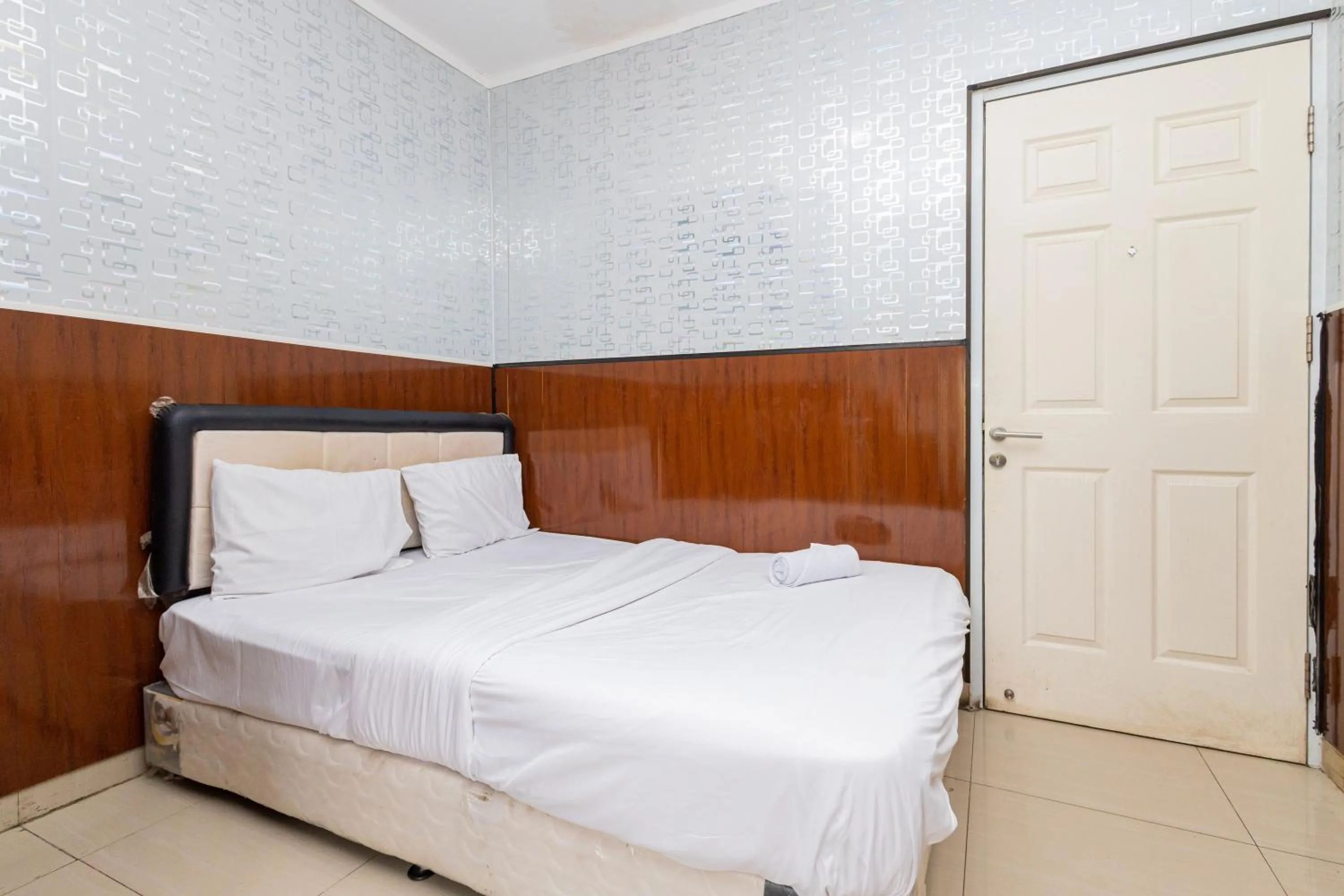 Bed in Alfa Guesthouse Serpong Mitra RedDoorz