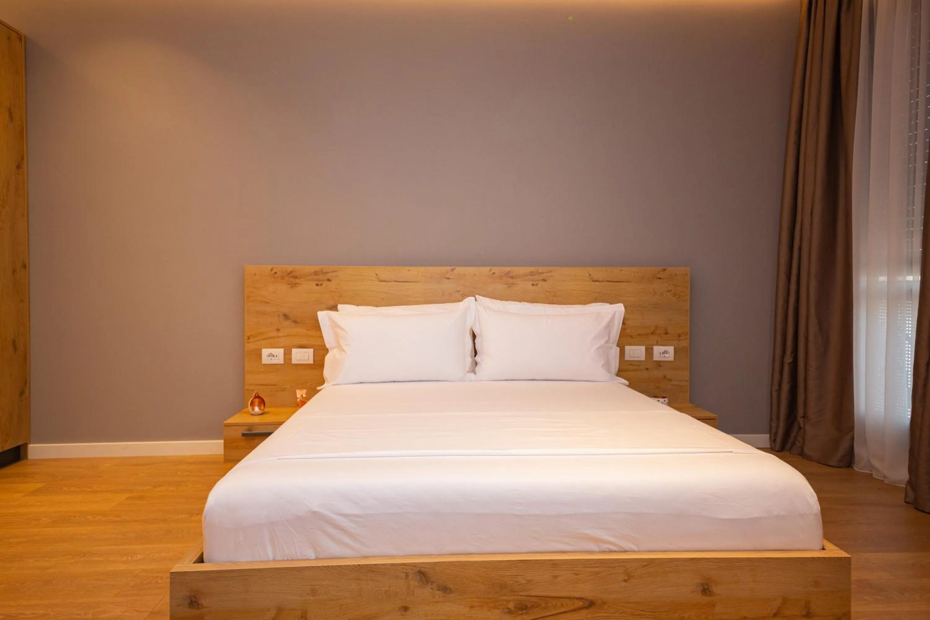 Bed in Central Chic Apartments