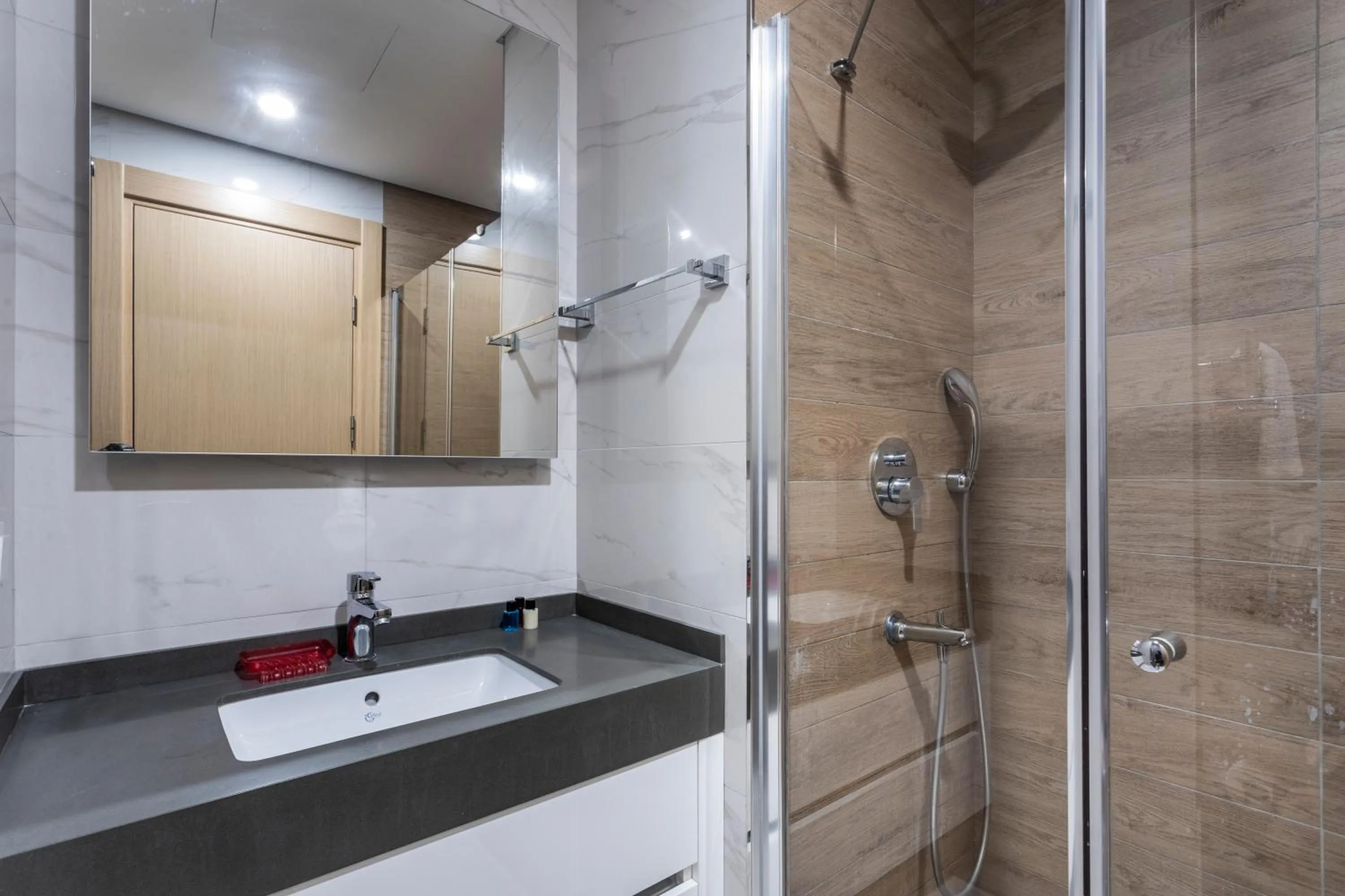 Bathroom in Grand Residence by NewInn