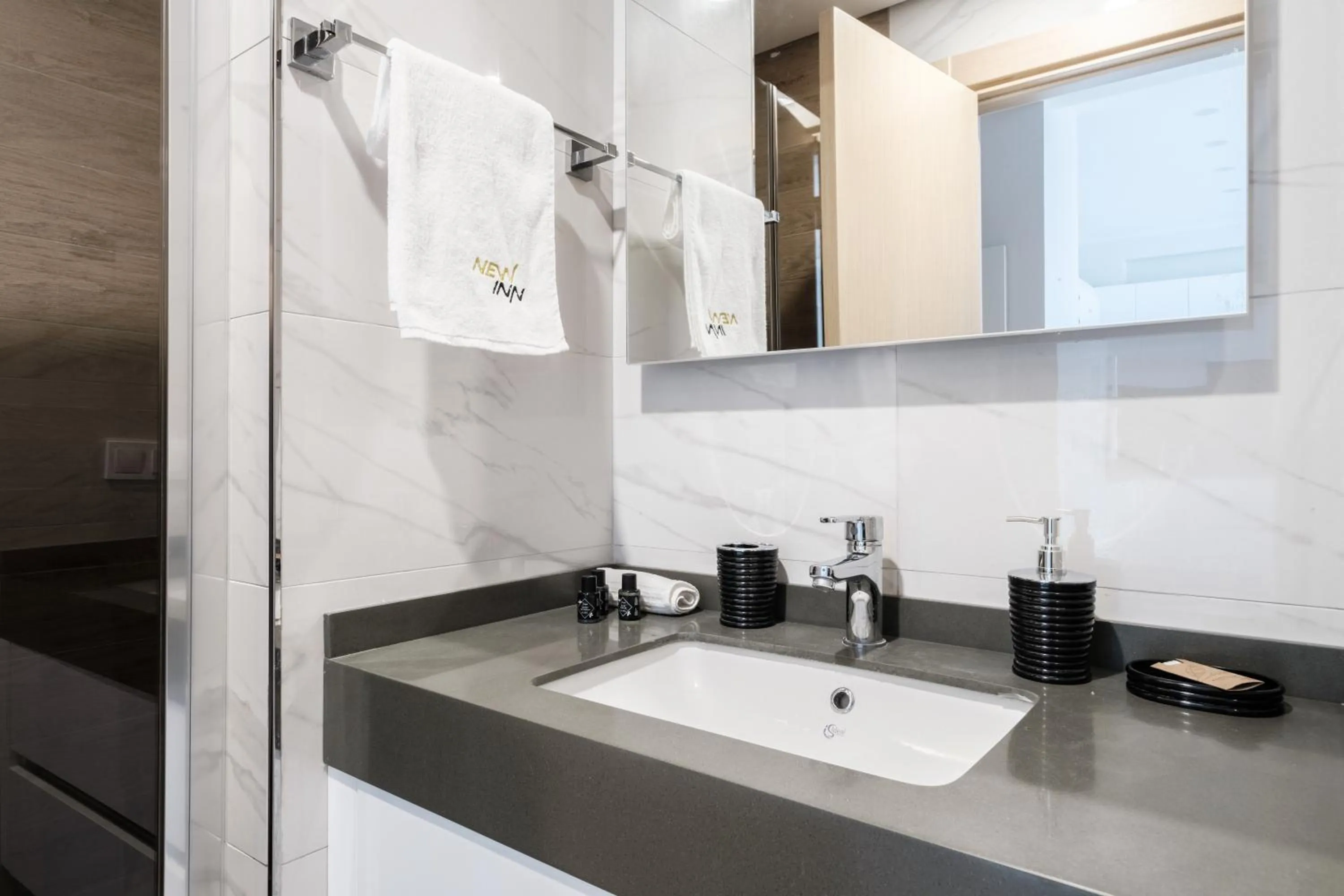 Bathroom in Grand Residence by NewInn