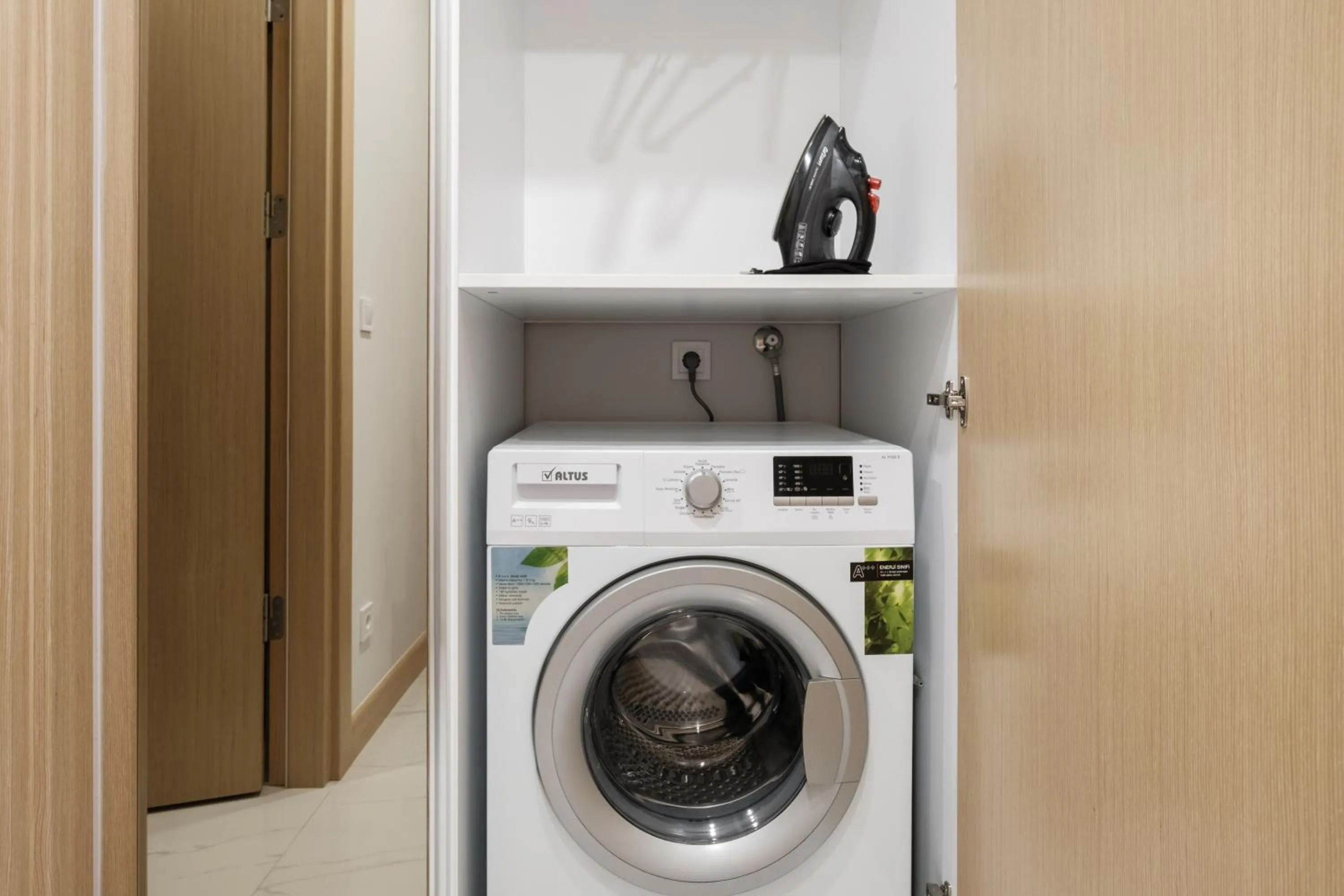 washing machine in Grand Residence by NewInn