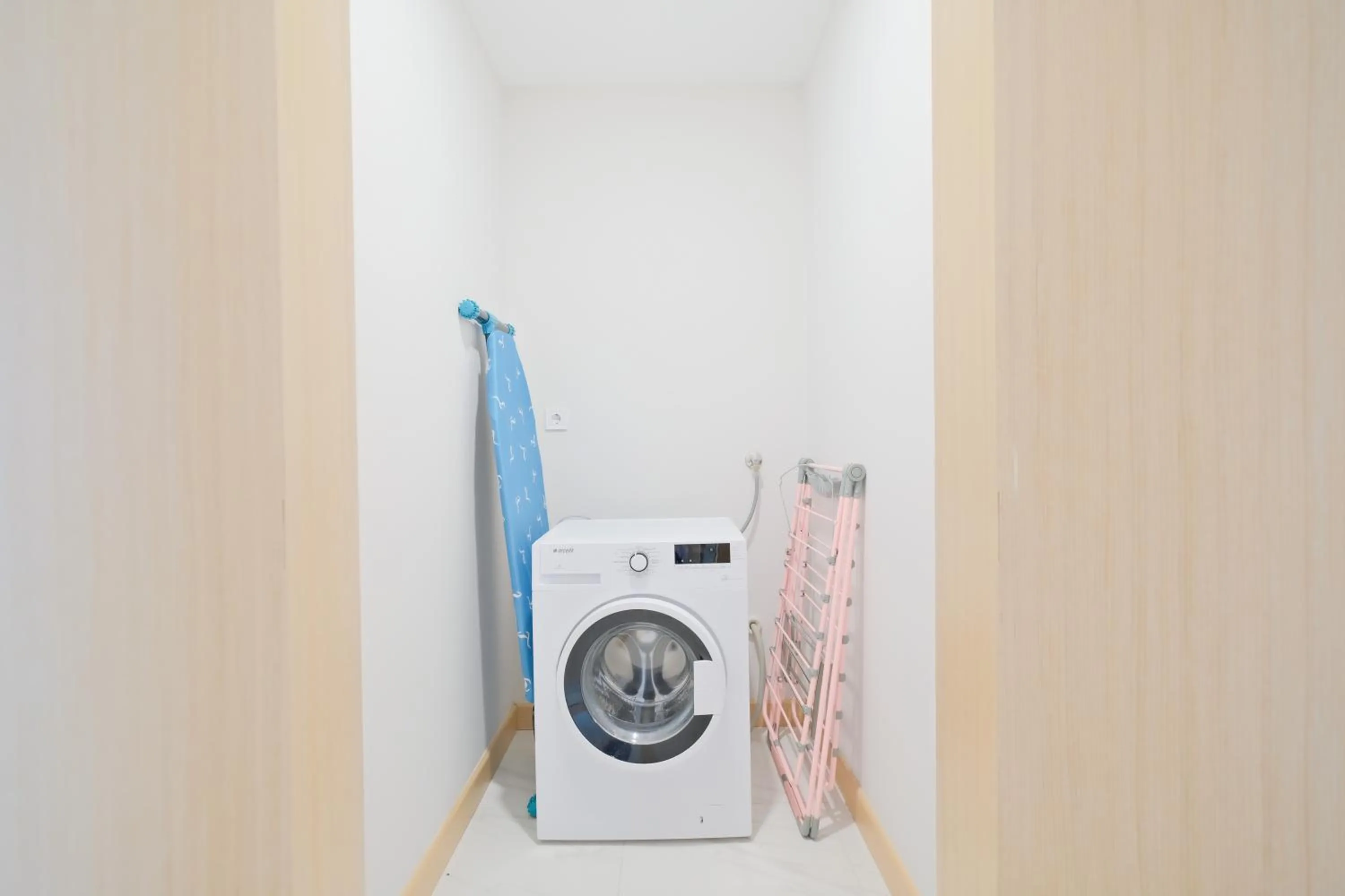washing machine in Grand Residence by NewInn