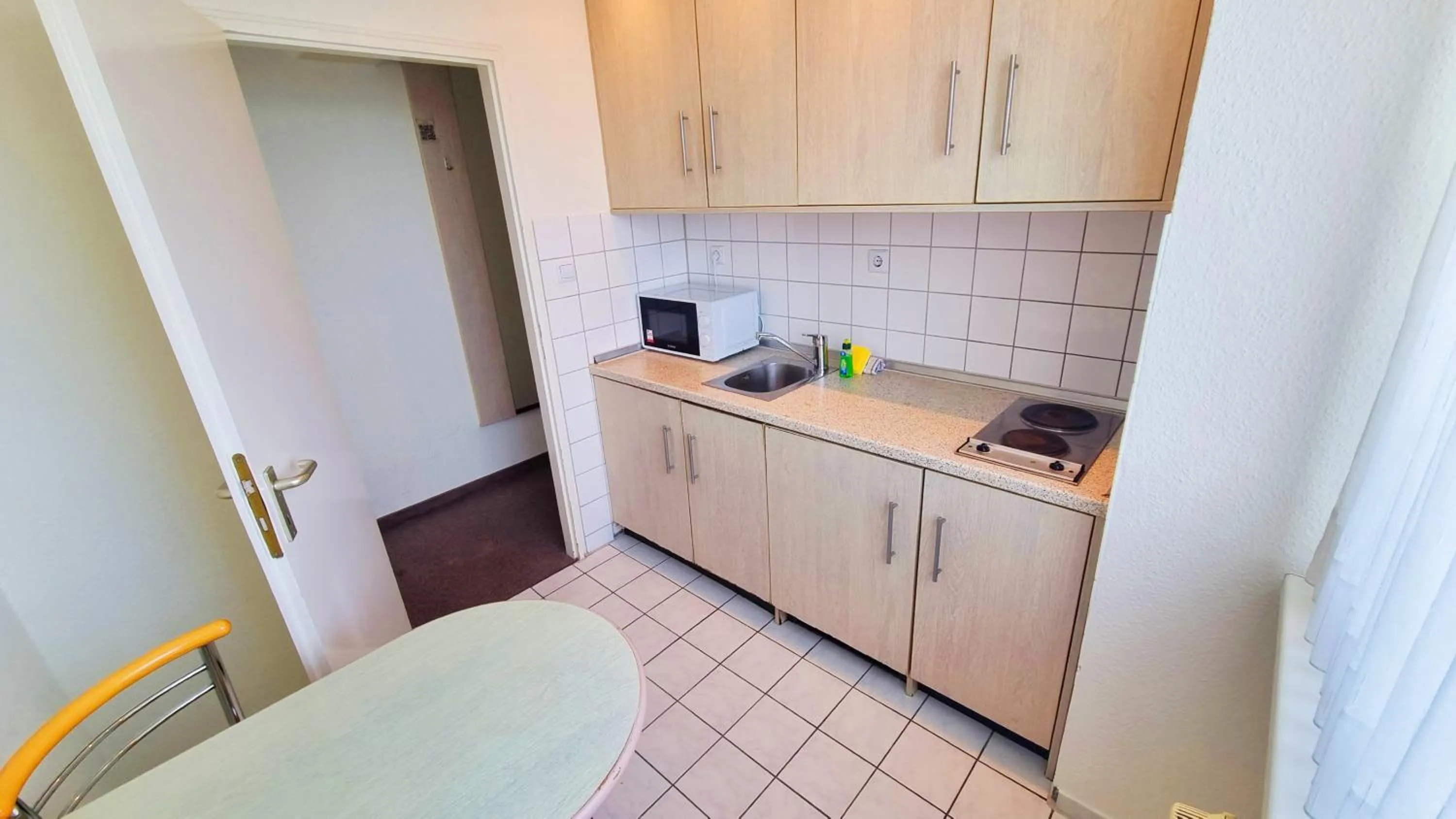 Kitchen or kitchenette in Panorama Inn Hotel und Boardinghaus