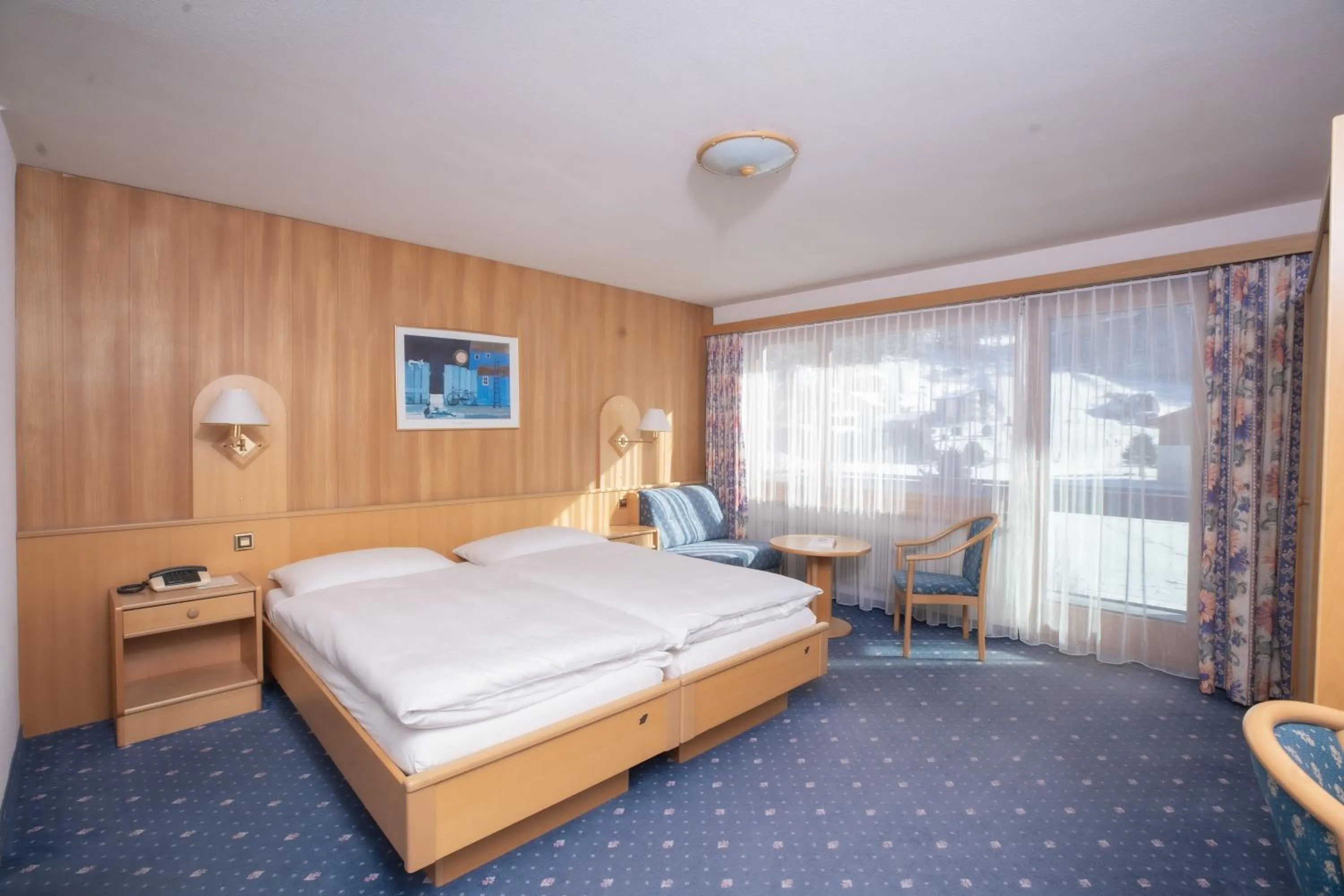 Bed in Hotel Alpenhof