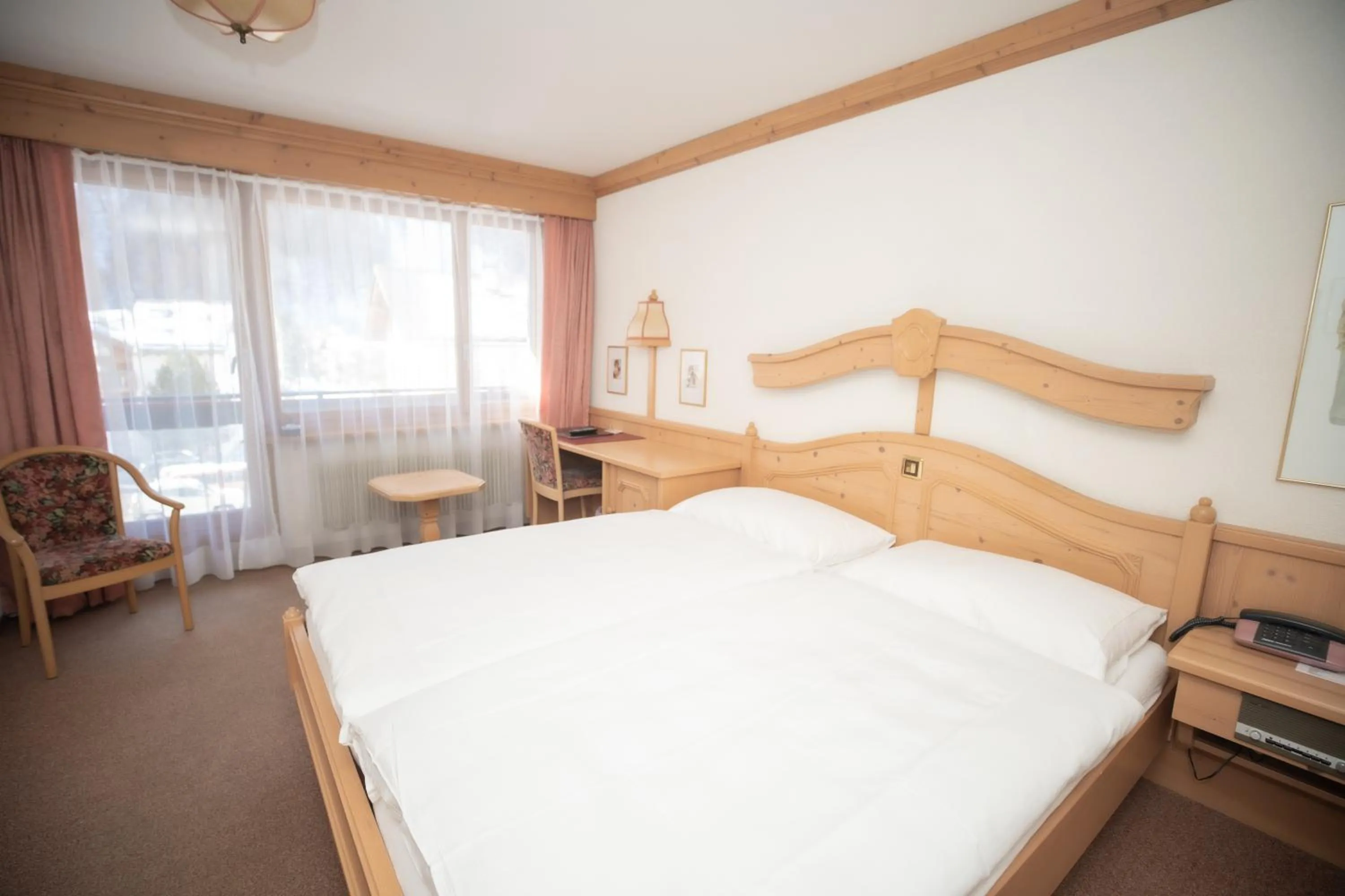 Bed in Hotel Alpenhof