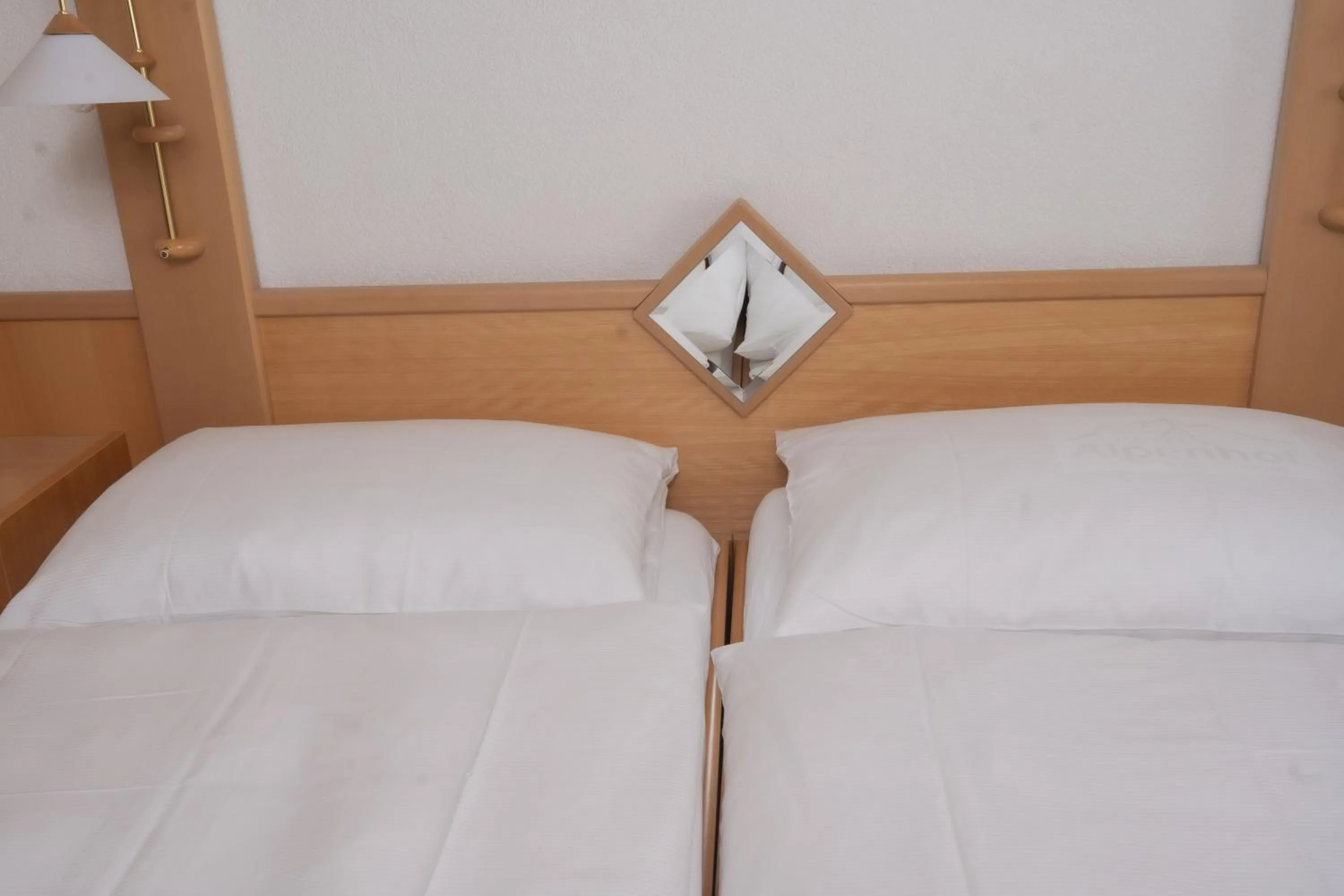 Bed in Hotel Alpenhof