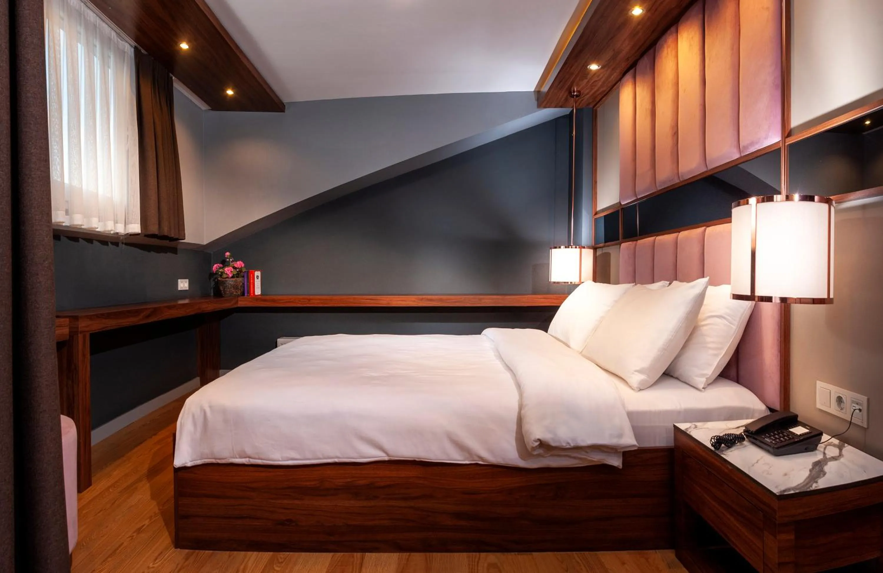 Bed in Vitabella Suites