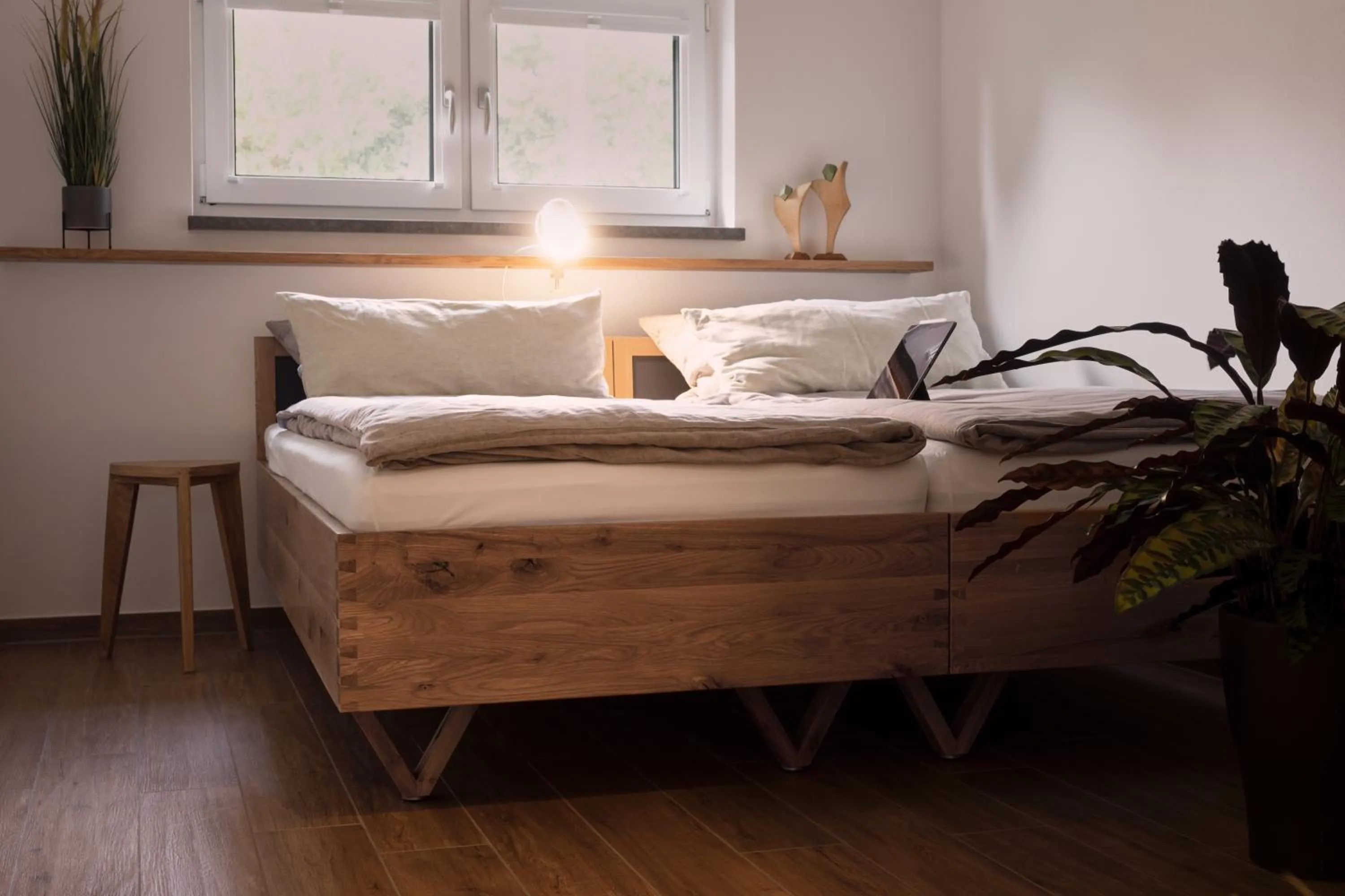 Bed in BLEIBE VIER Ferienwohnungen