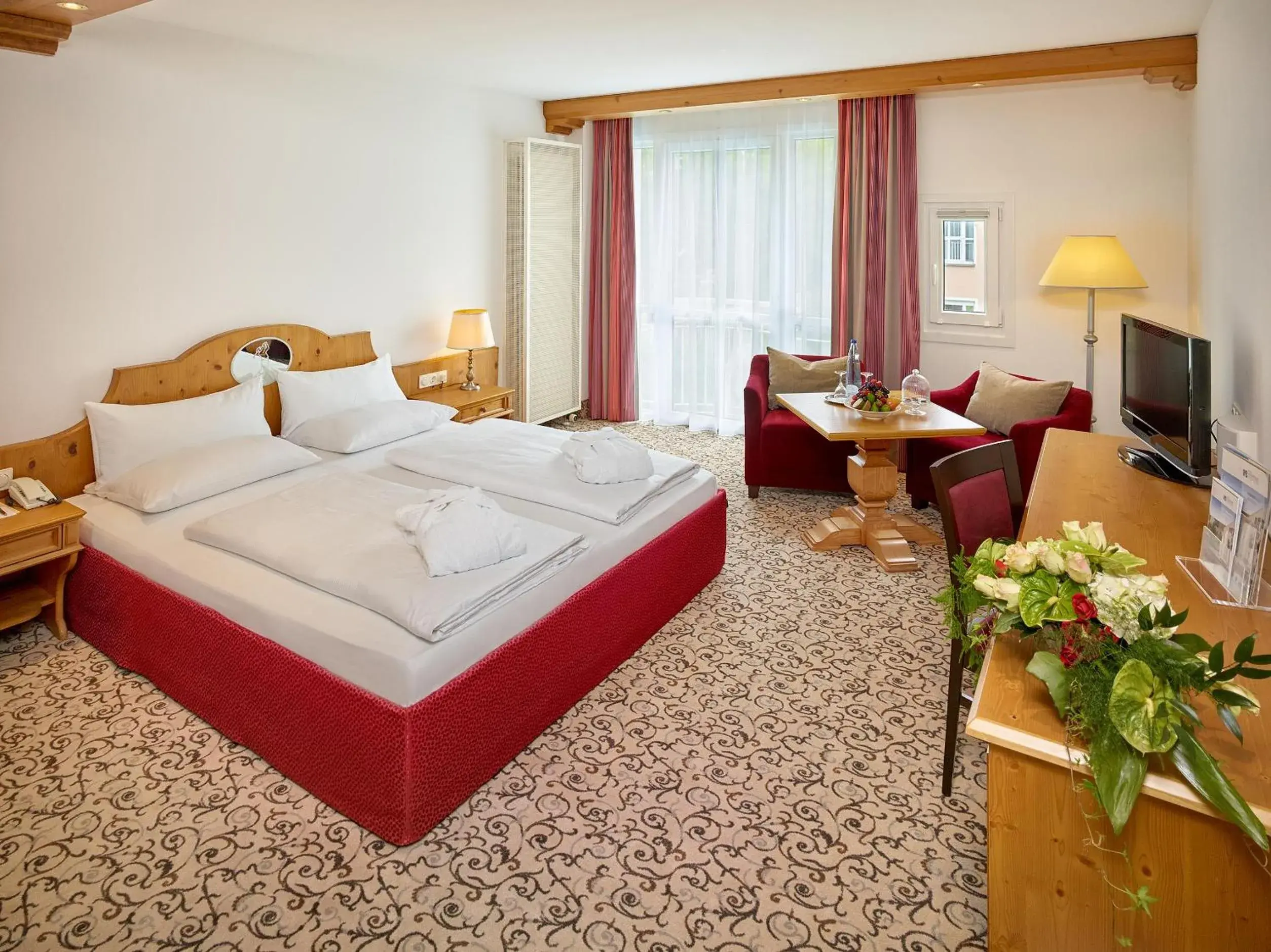 Photo of the whole room, Bed in Hotel Maximilian - Wellness und Golfhotel