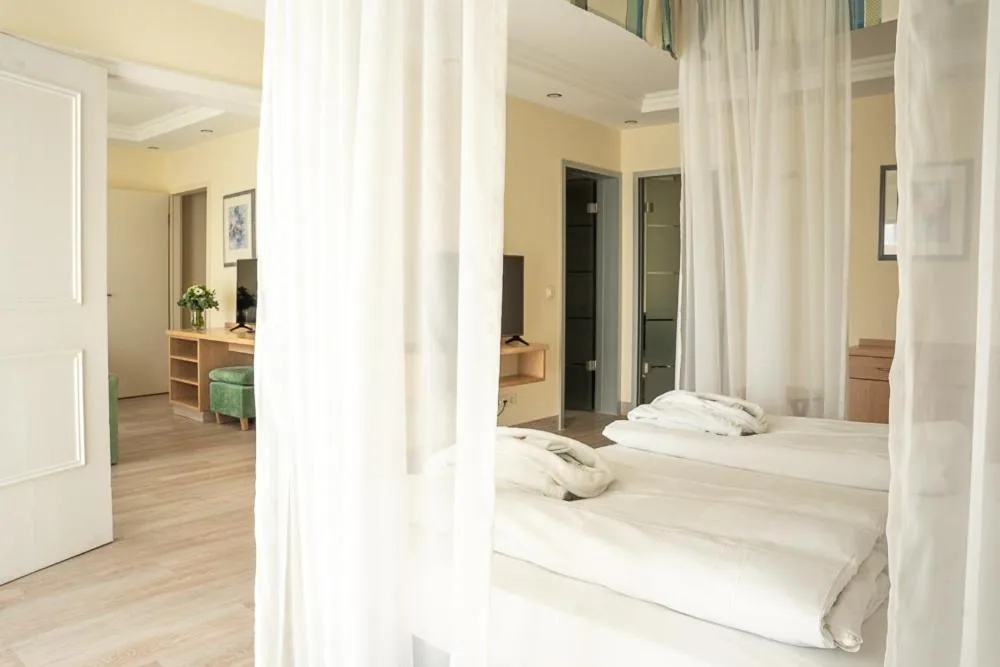 Bed in MAXIMILIAN Grand Hotel