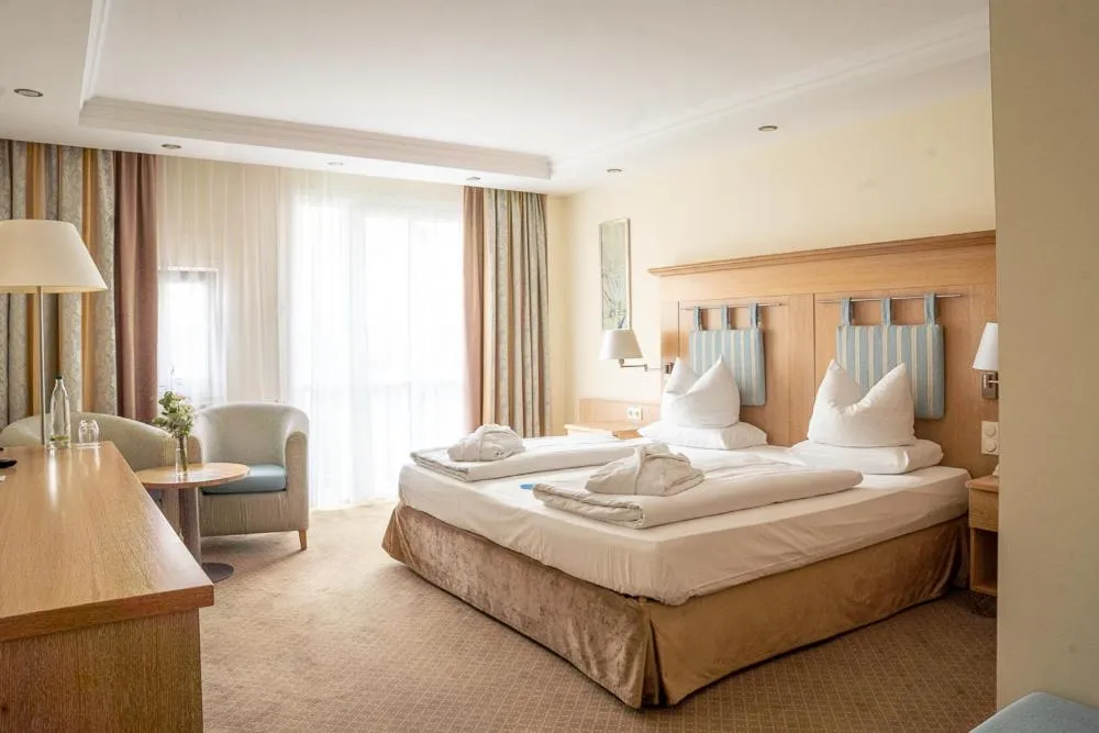 Bed in MAXIMILIAN Grand Hotel