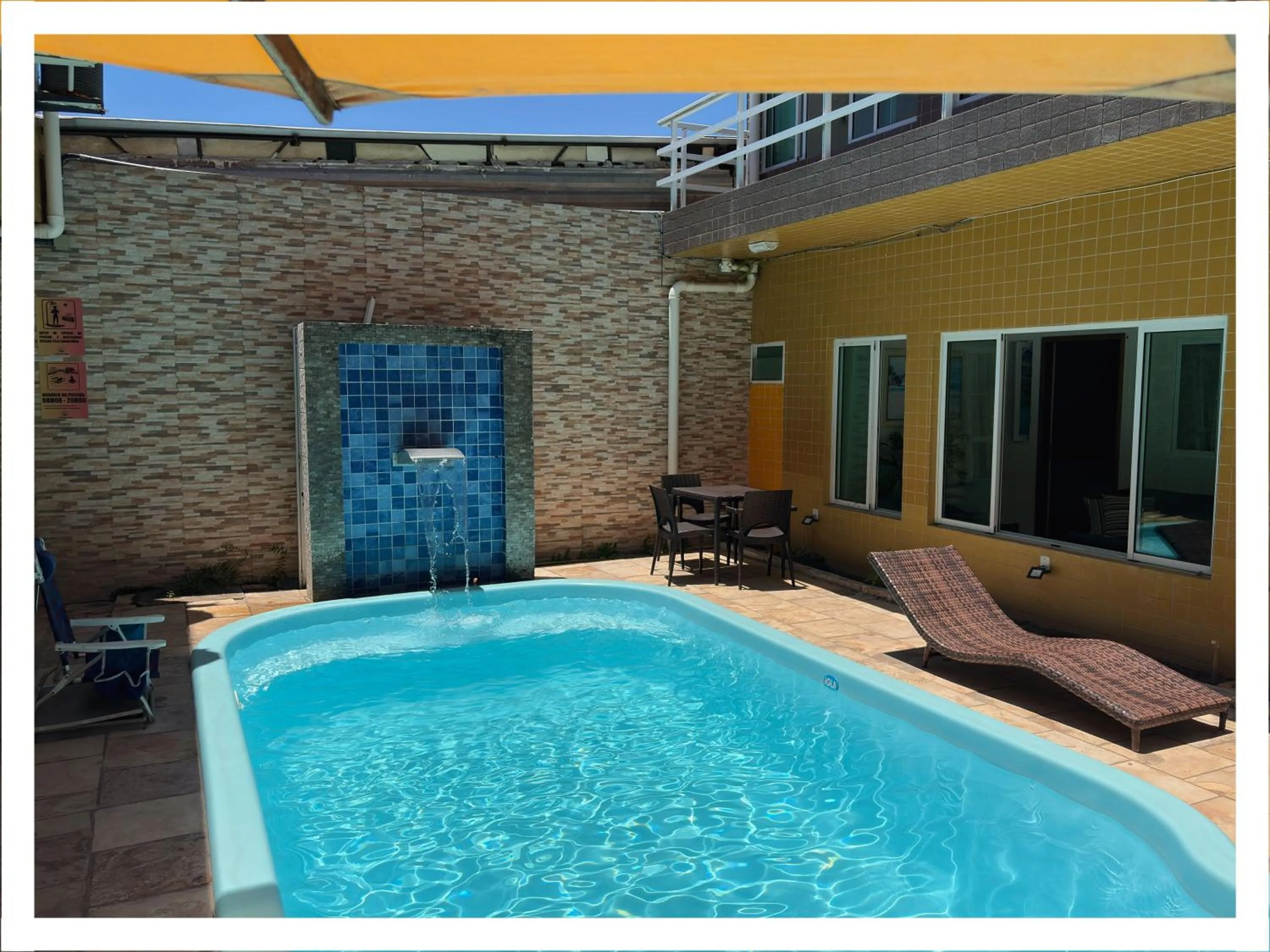 Swimming pool in Pousada Residência dos Sonhos