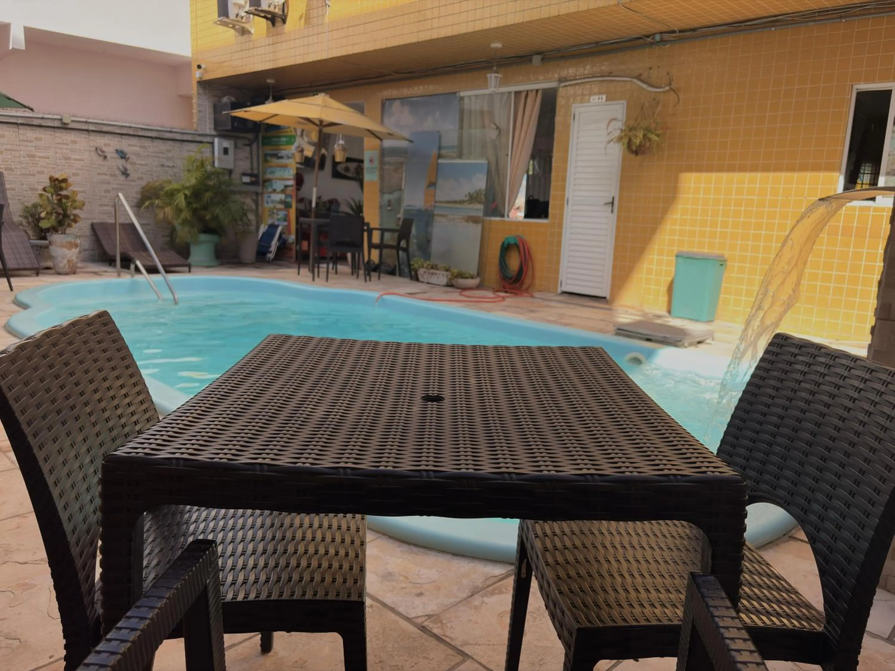 Swimming pool in Pousada Residência dos Sonhos