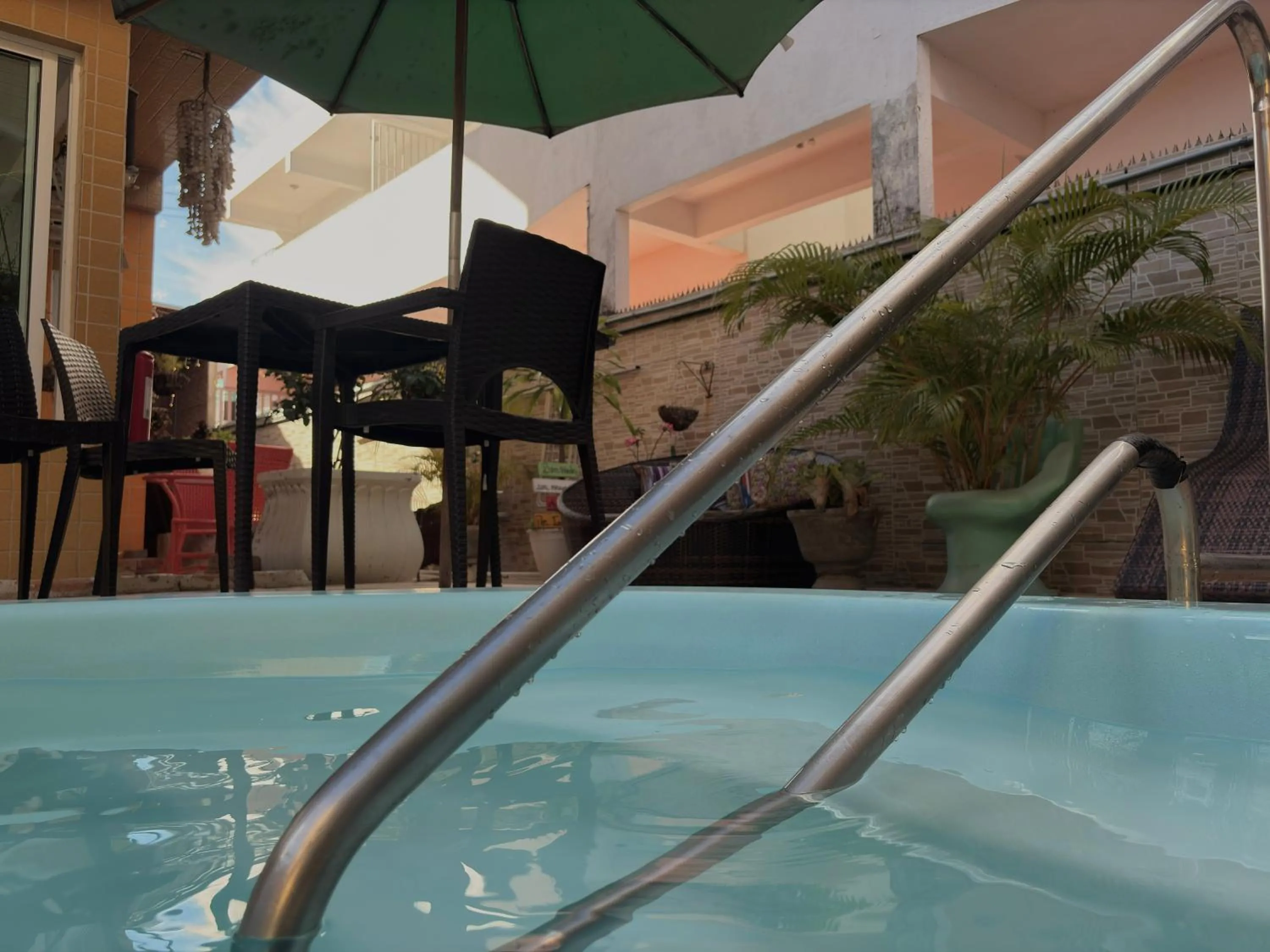 Swimming pool in Pousada Residência dos Sonhos