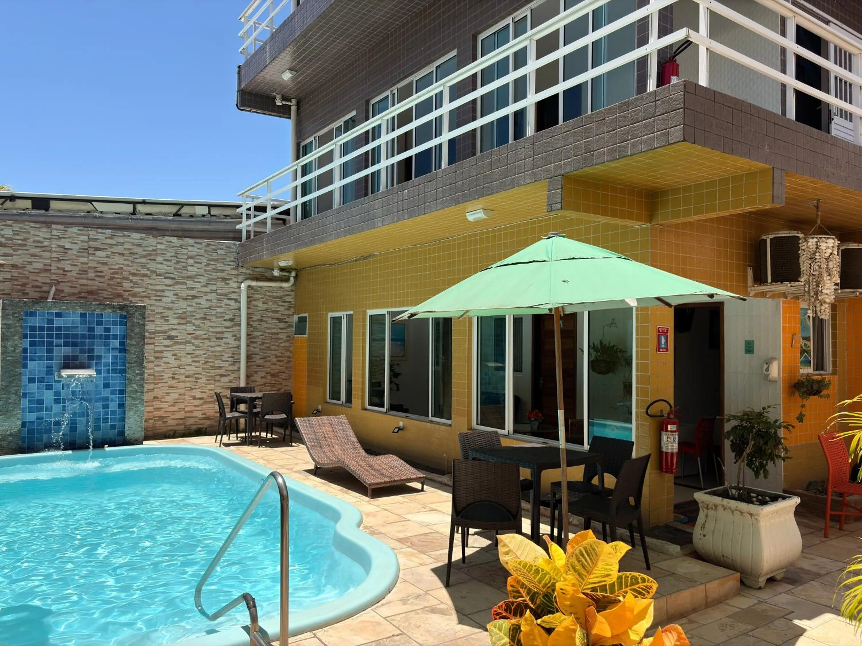 Swimming pool in Pousada Residência dos Sonhos