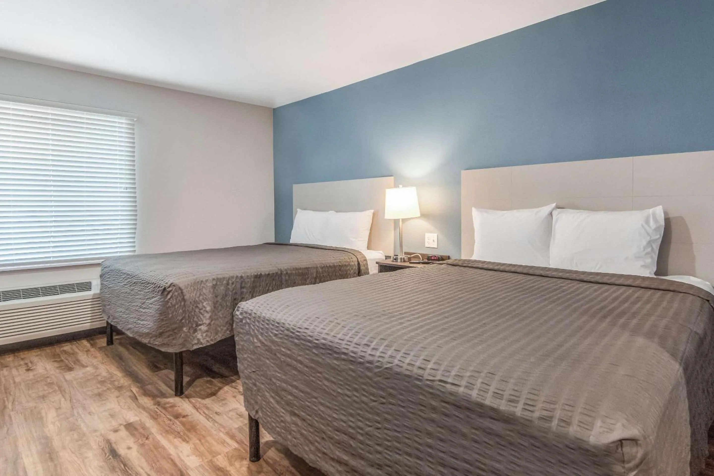 Photo of the whole room, Bed in WoodSpring Suites North Ft Worth Alliance TX Speedway