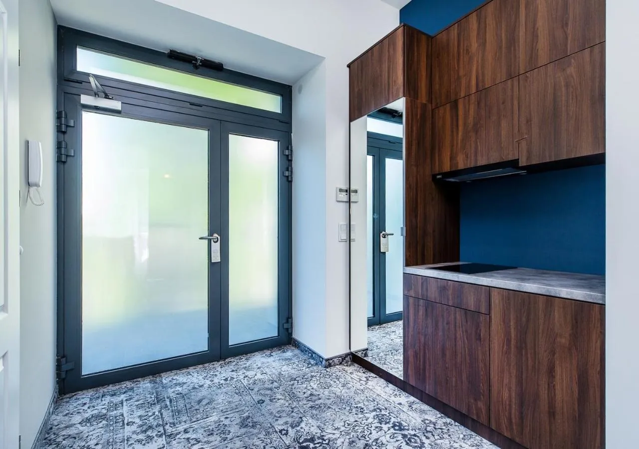 Kitchen or kitchenette in Aparthotel Cracovia Residence