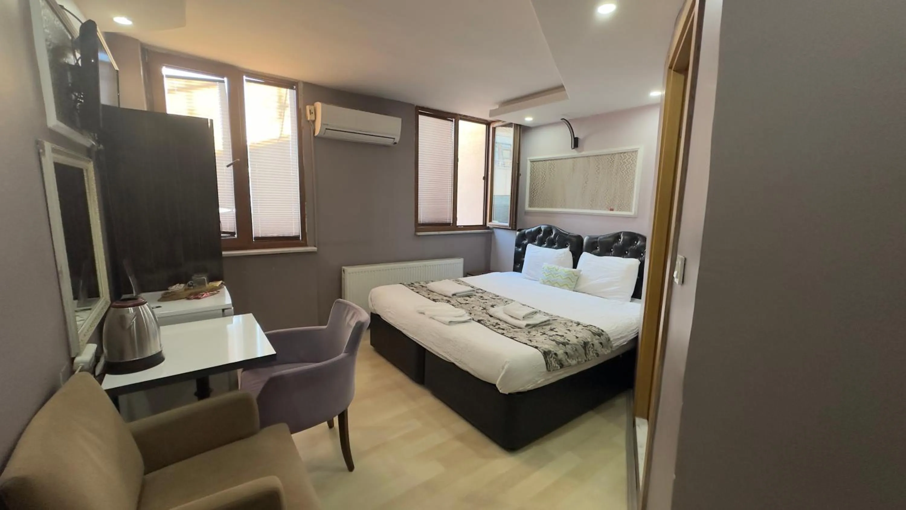 Bed in Mitra Downtown Hotel