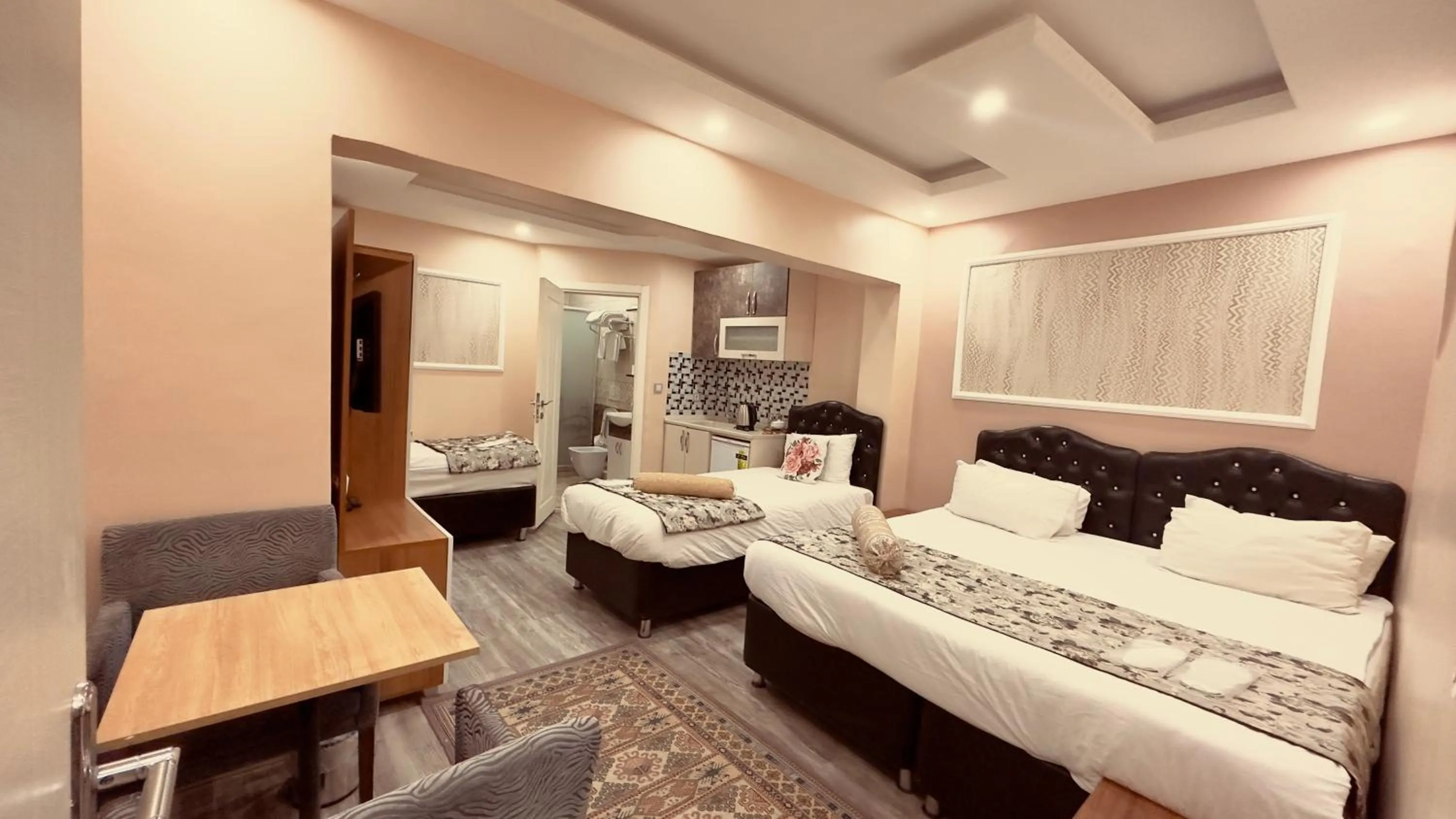 Photo of the whole room, Bed in Mitra Downtown Hotel