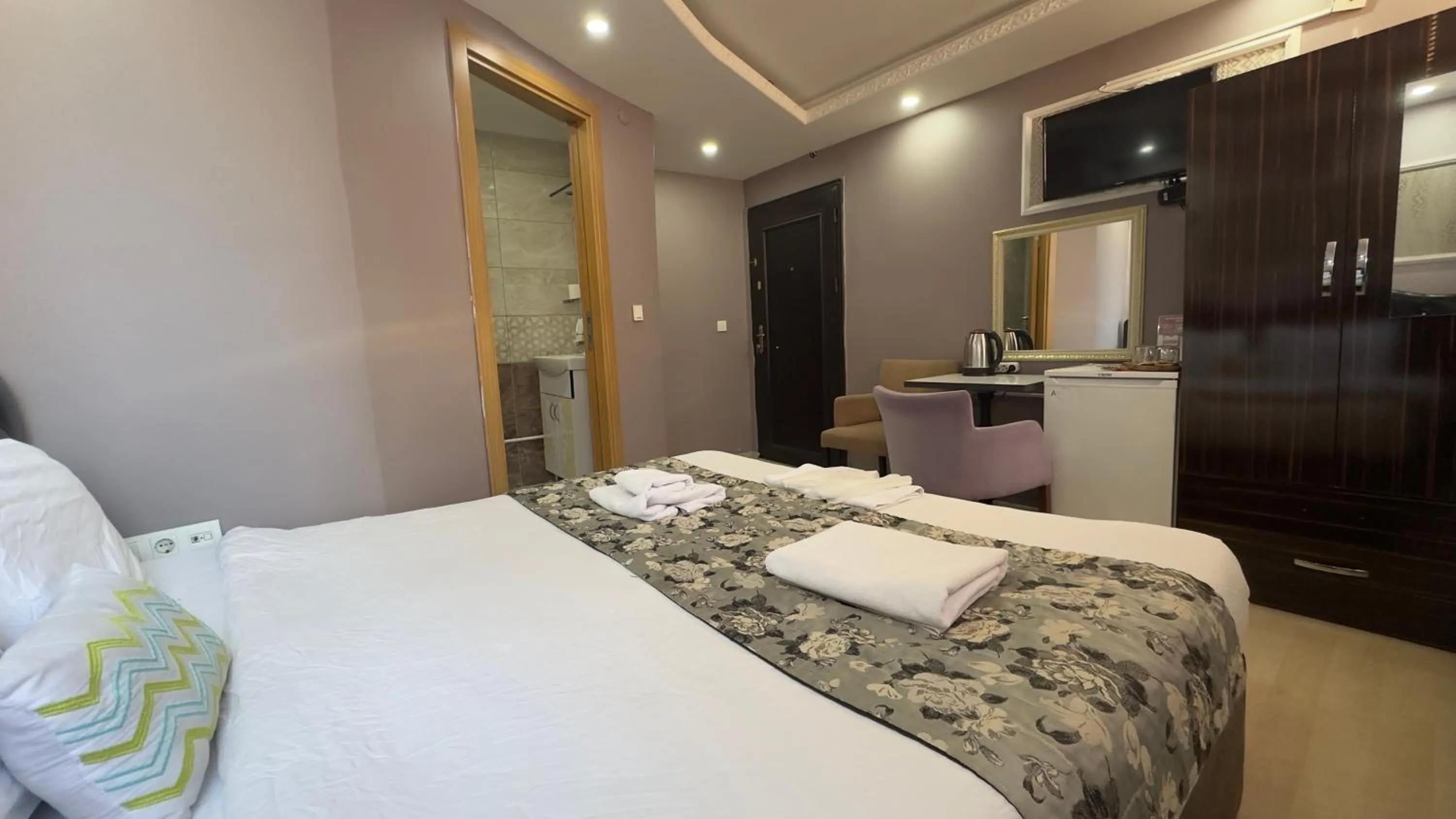 Bed in Mitra Downtown Hotel