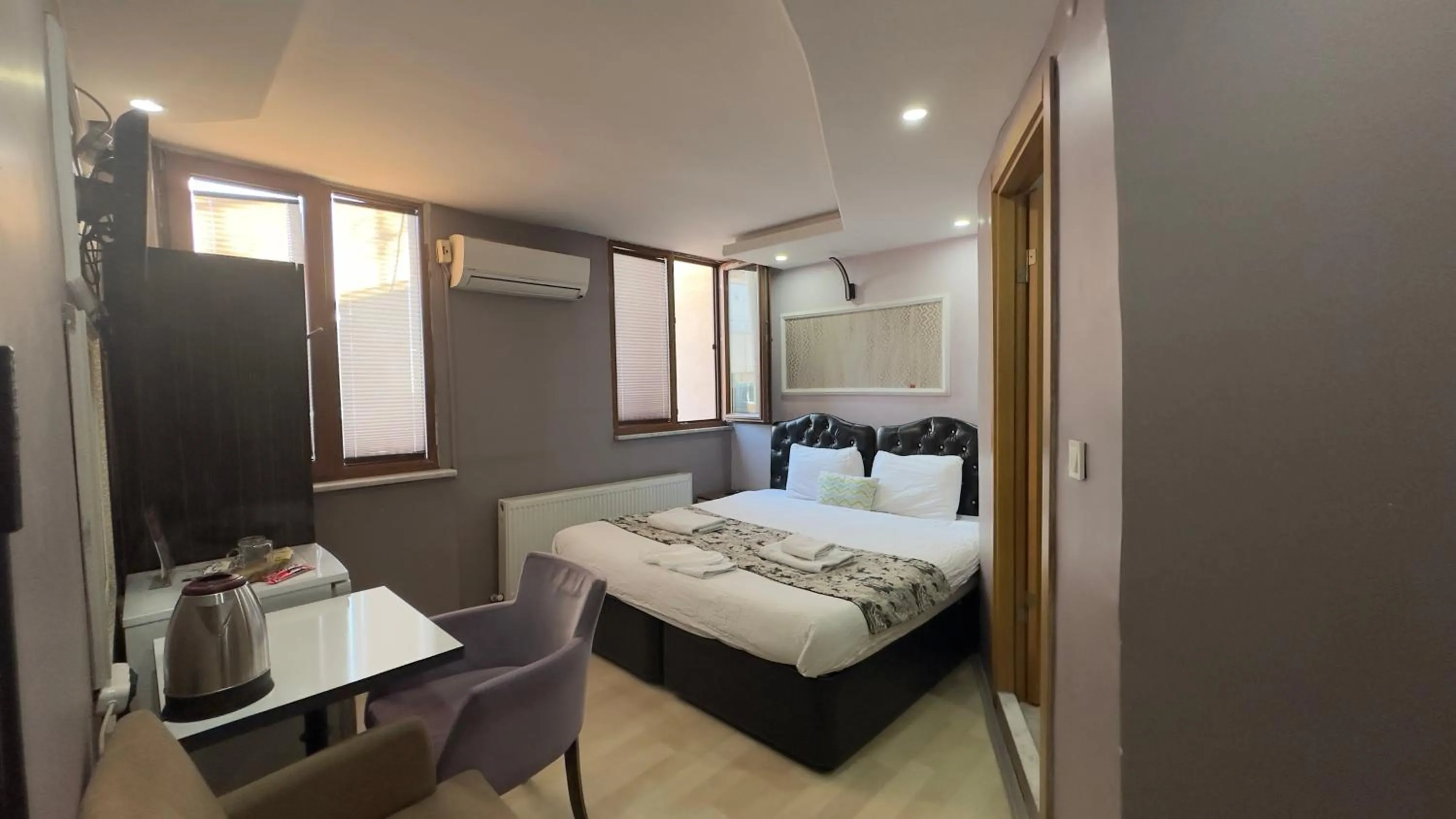 Bed in Mitra Downtown Hotel