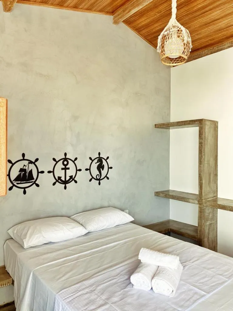 Bed in Pousada Primeira Praia Suítes