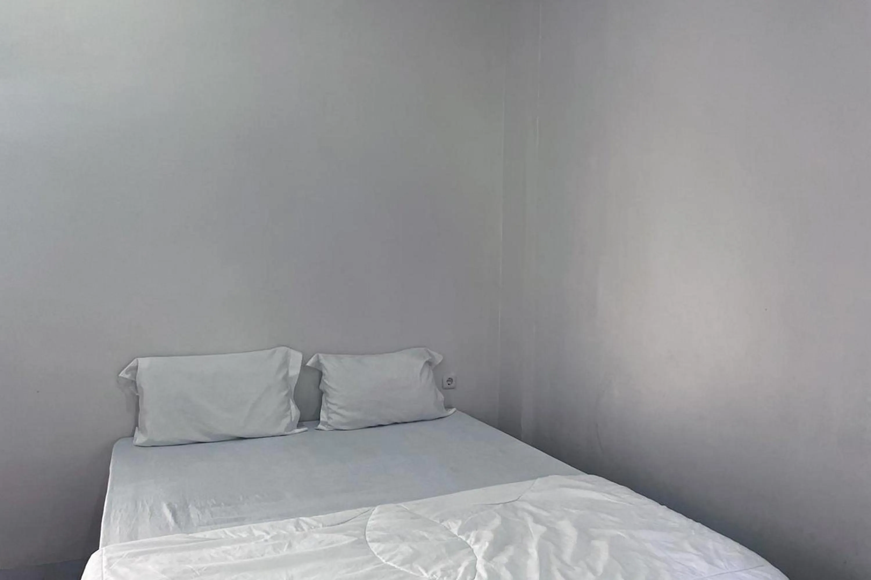 Bed in Wisma Maestro Toraja Mitra RedDoorz