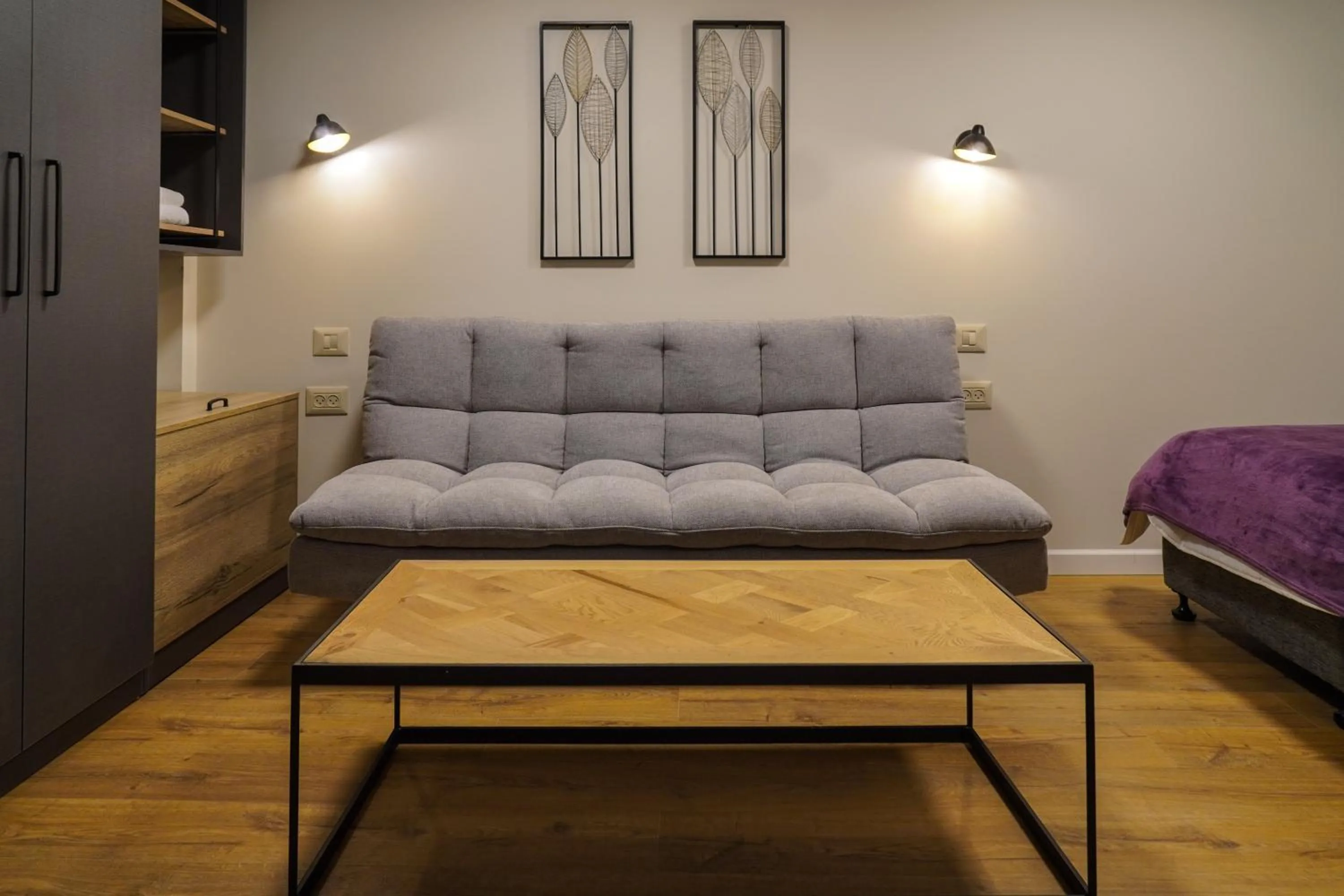 Seating area, Bed in Apartique Hotel