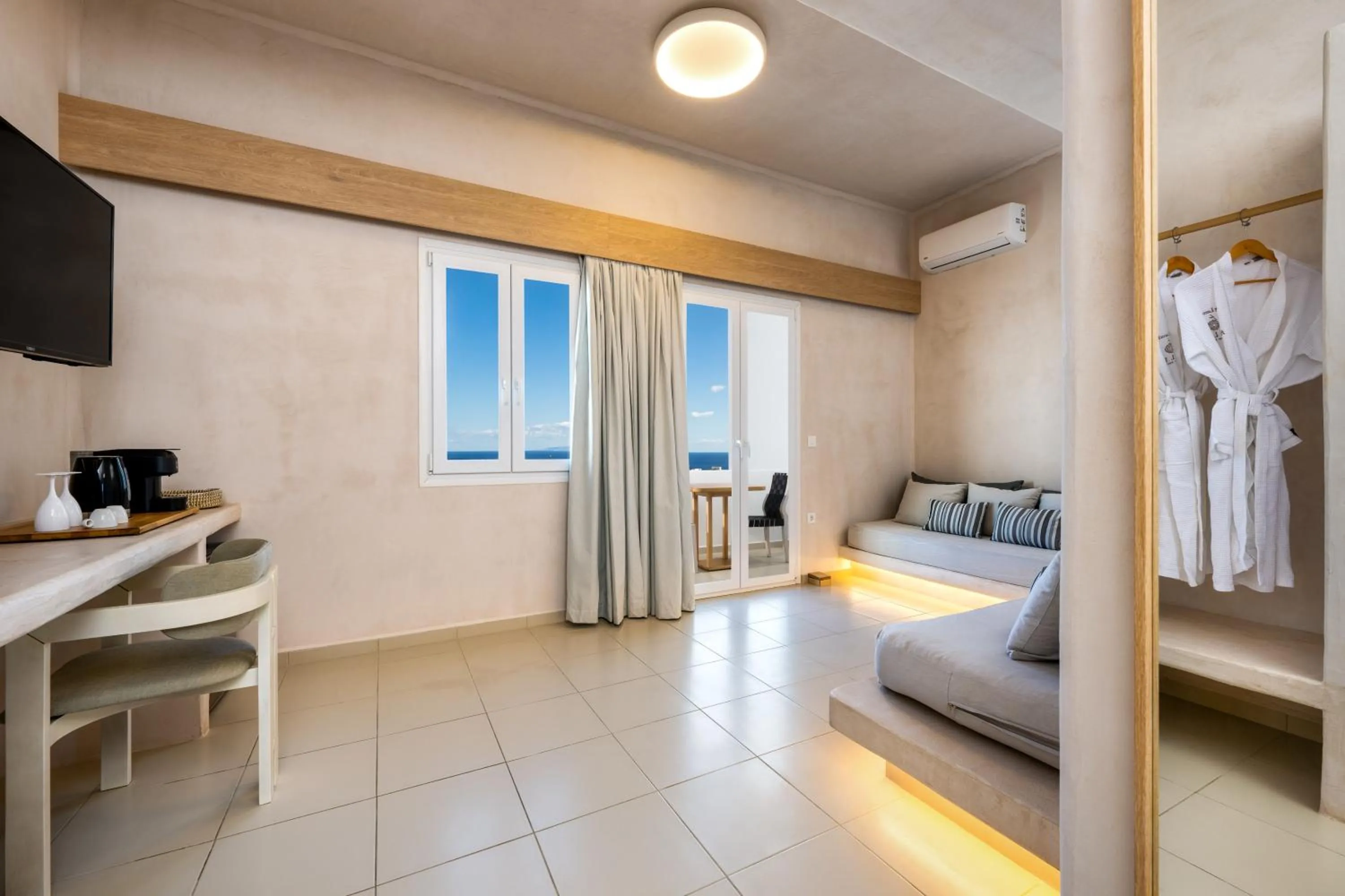 Seating area, Bed in Aelia Luxury Suites