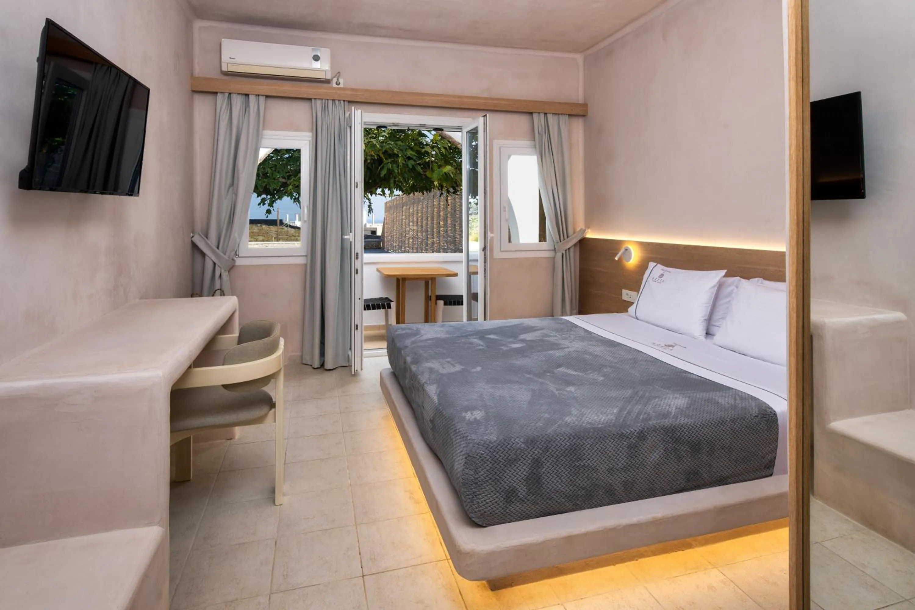 Bed in Aelia Luxury Suites