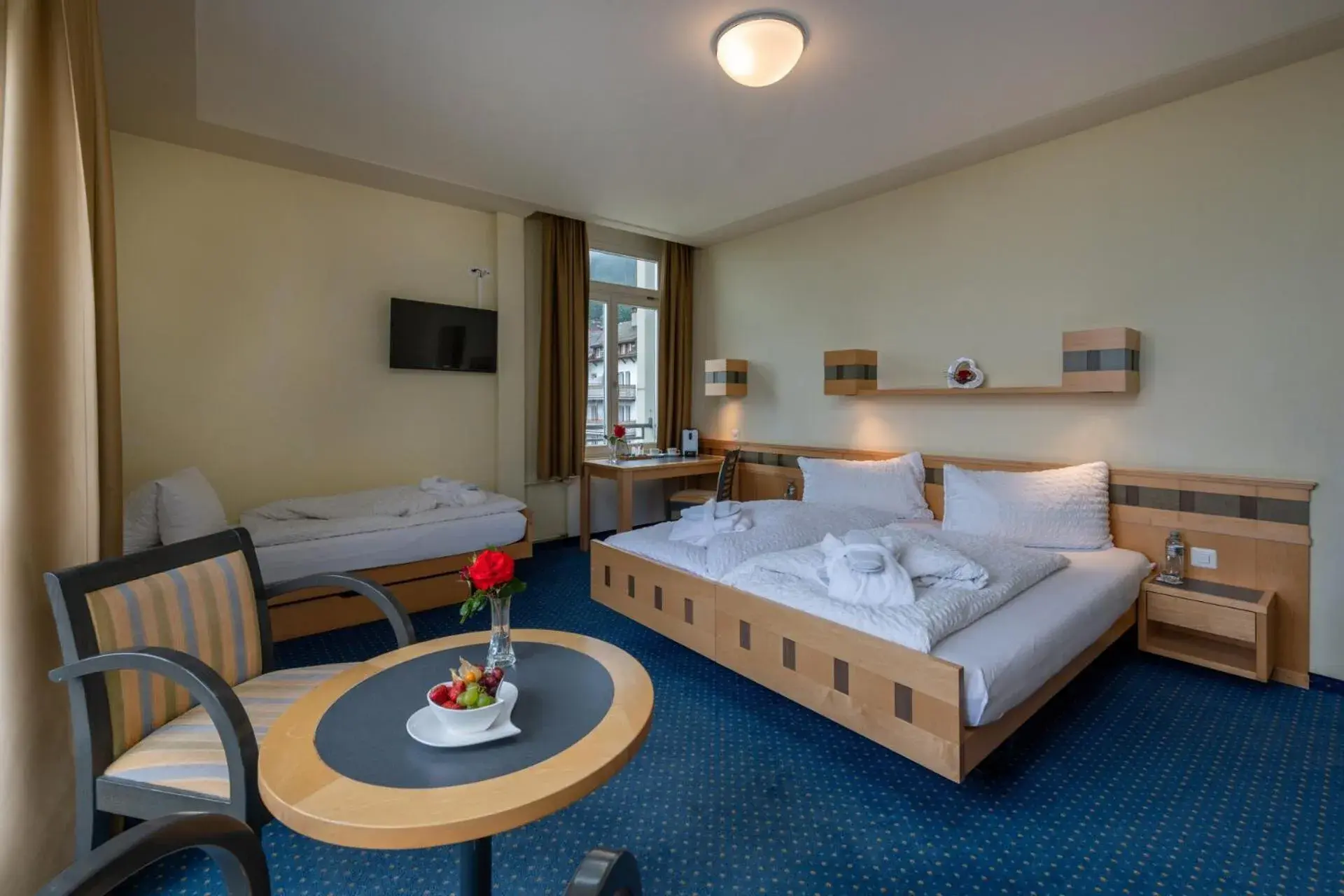 Bed in Hotel Victoria Lauberhorn Wengen, a Faern Collection Hotel Bed in Hotel Victoria Lauberhorn Wengen, a Faern Collection Hotel