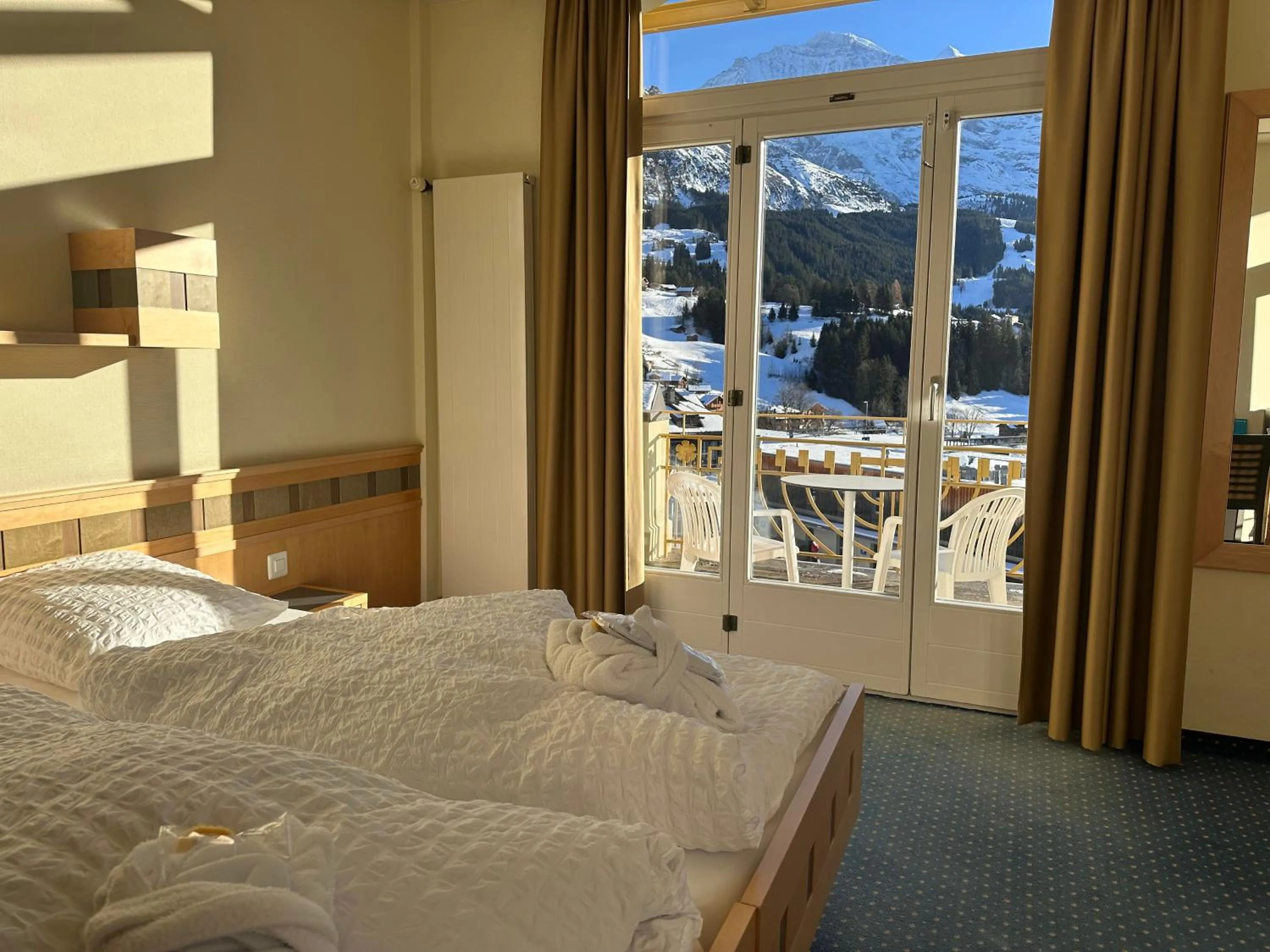 View (from property/room), Bed in Hotel Victoria Lauberhorn Wengen, a Faern Collection Hotel