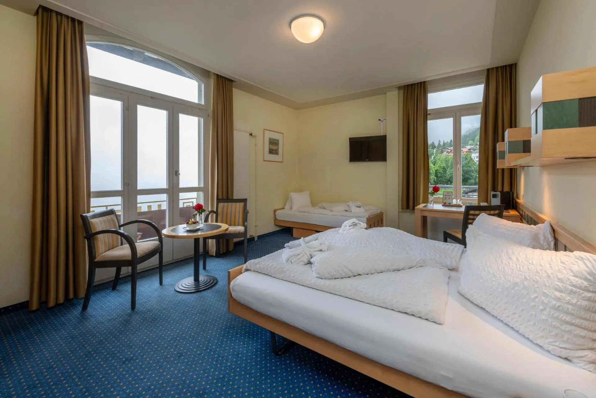 Photo of the whole room, Bed in Hotel Victoria Lauberhorn Wengen, a Faern Collection Hotel