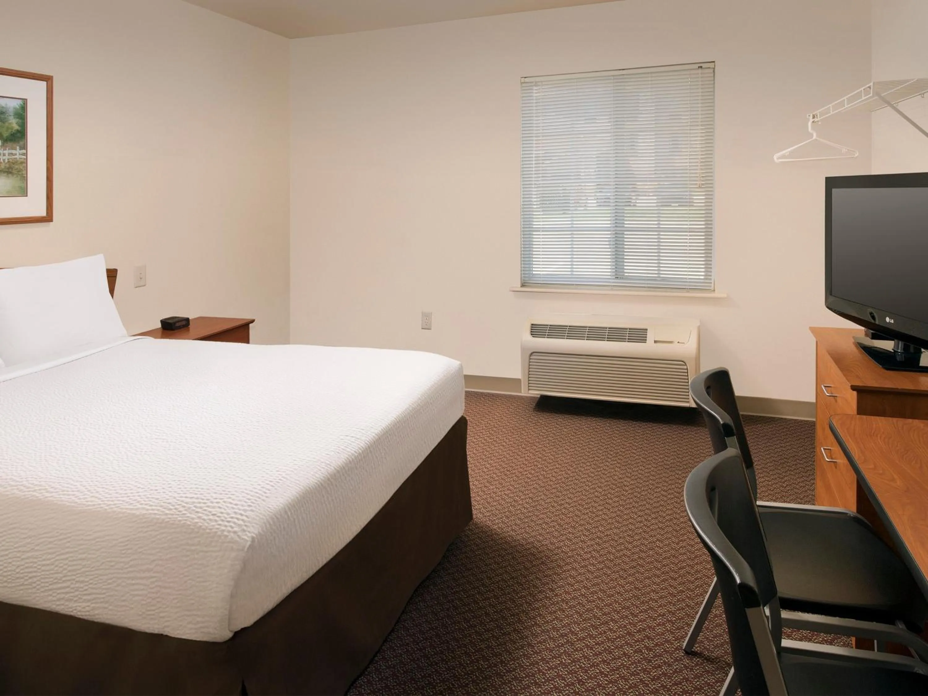 Bed in WoodSpring Suites Junction City