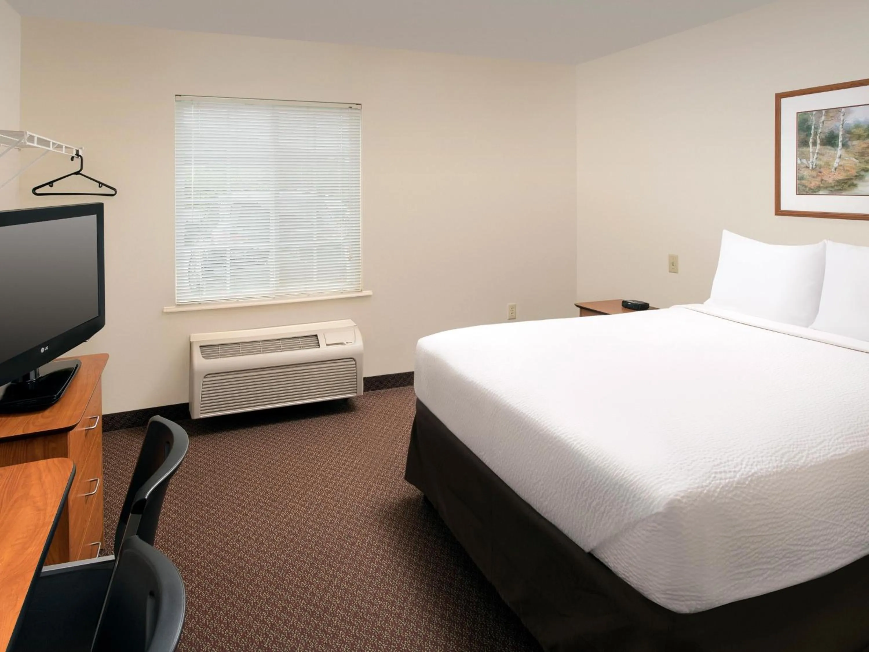 Bed in WoodSpring Suites Junction City