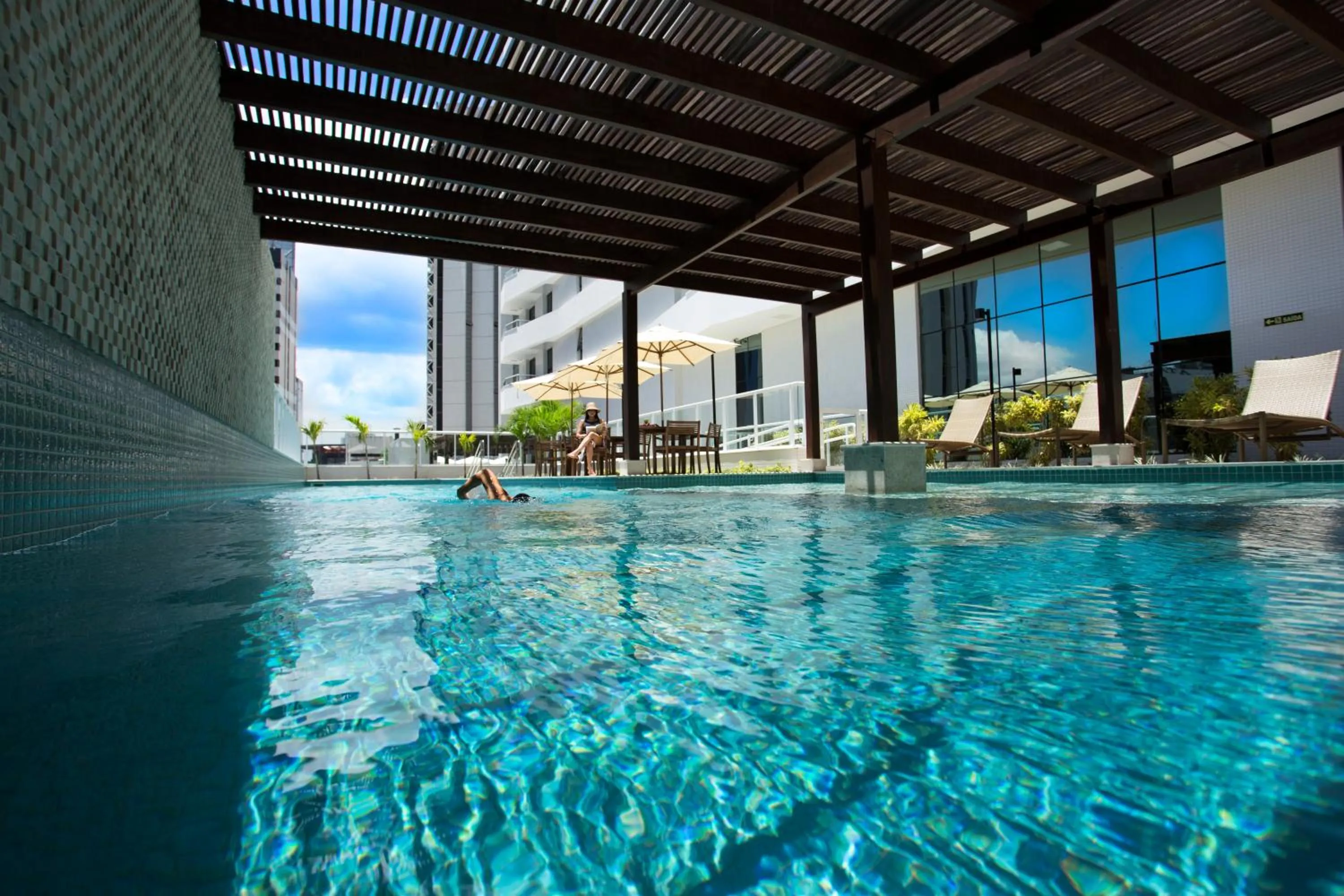 Swimming pool in Astron Suítes Mondial Salvador by Nobile