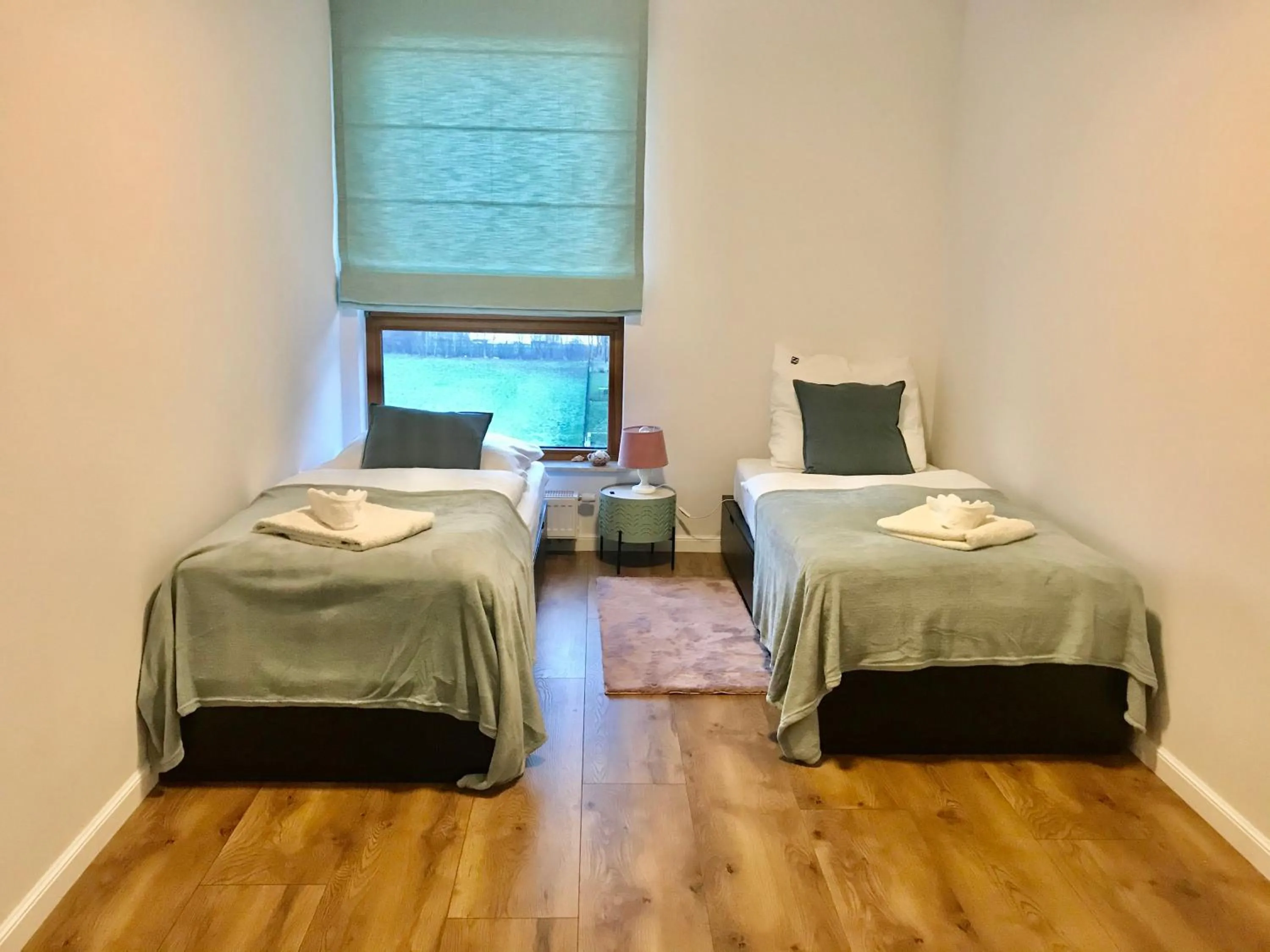Bed in Baltic Riviera Apartments - Garden Sanctuary Retreat