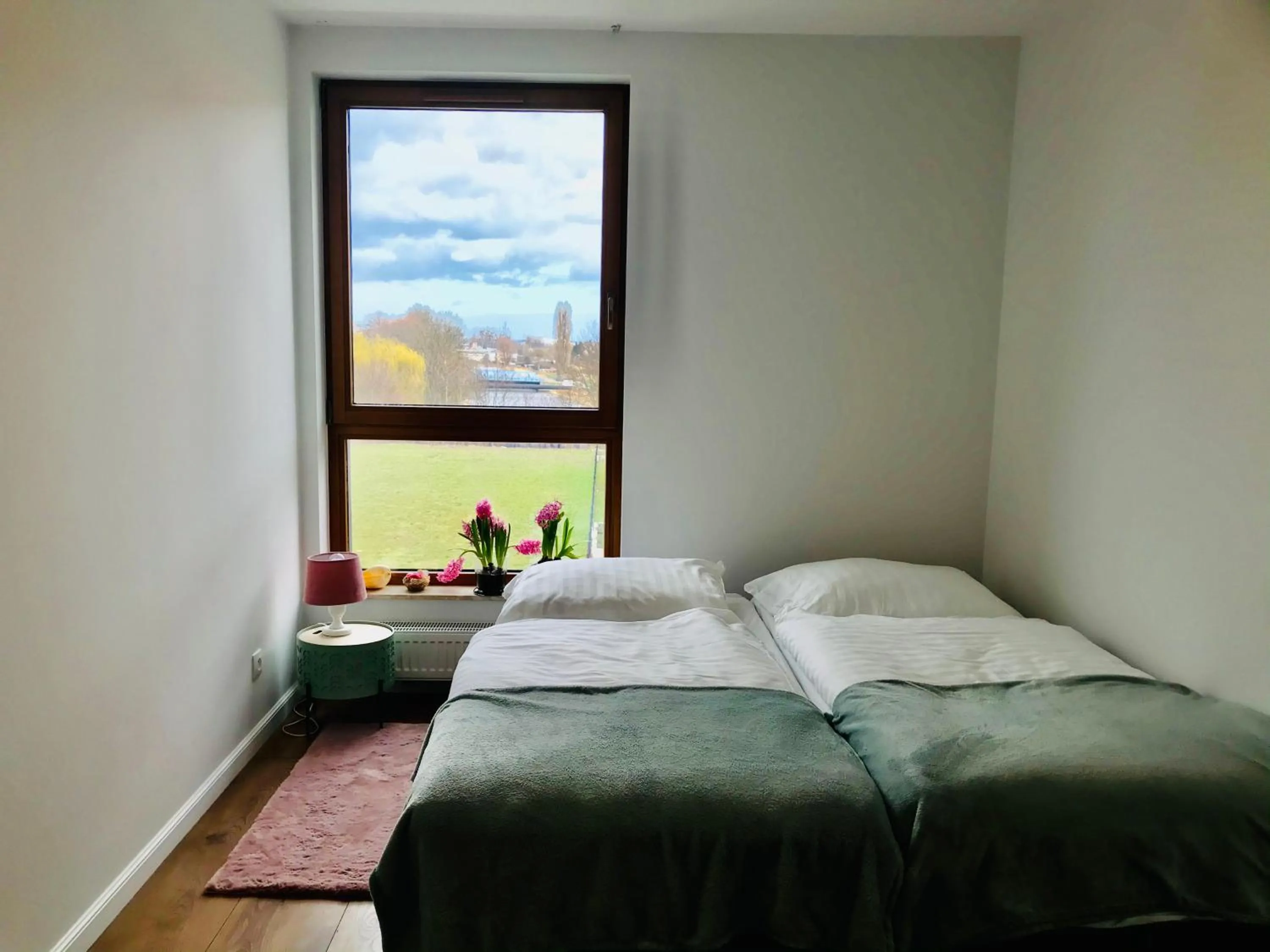 Bed in Baltic Riviera Apartments - Garden Sanctuary Retreat