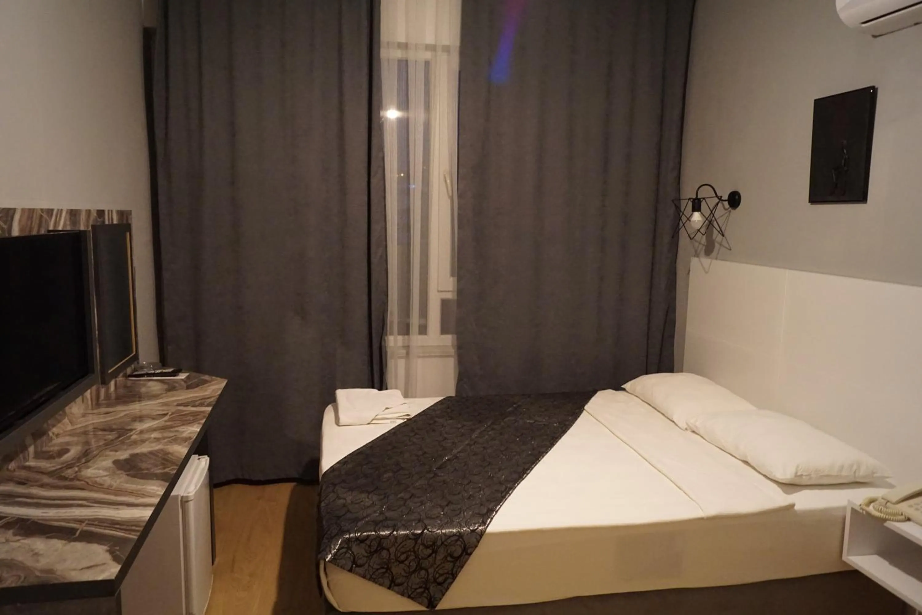 Bed in Aslan Sand & City Hotel