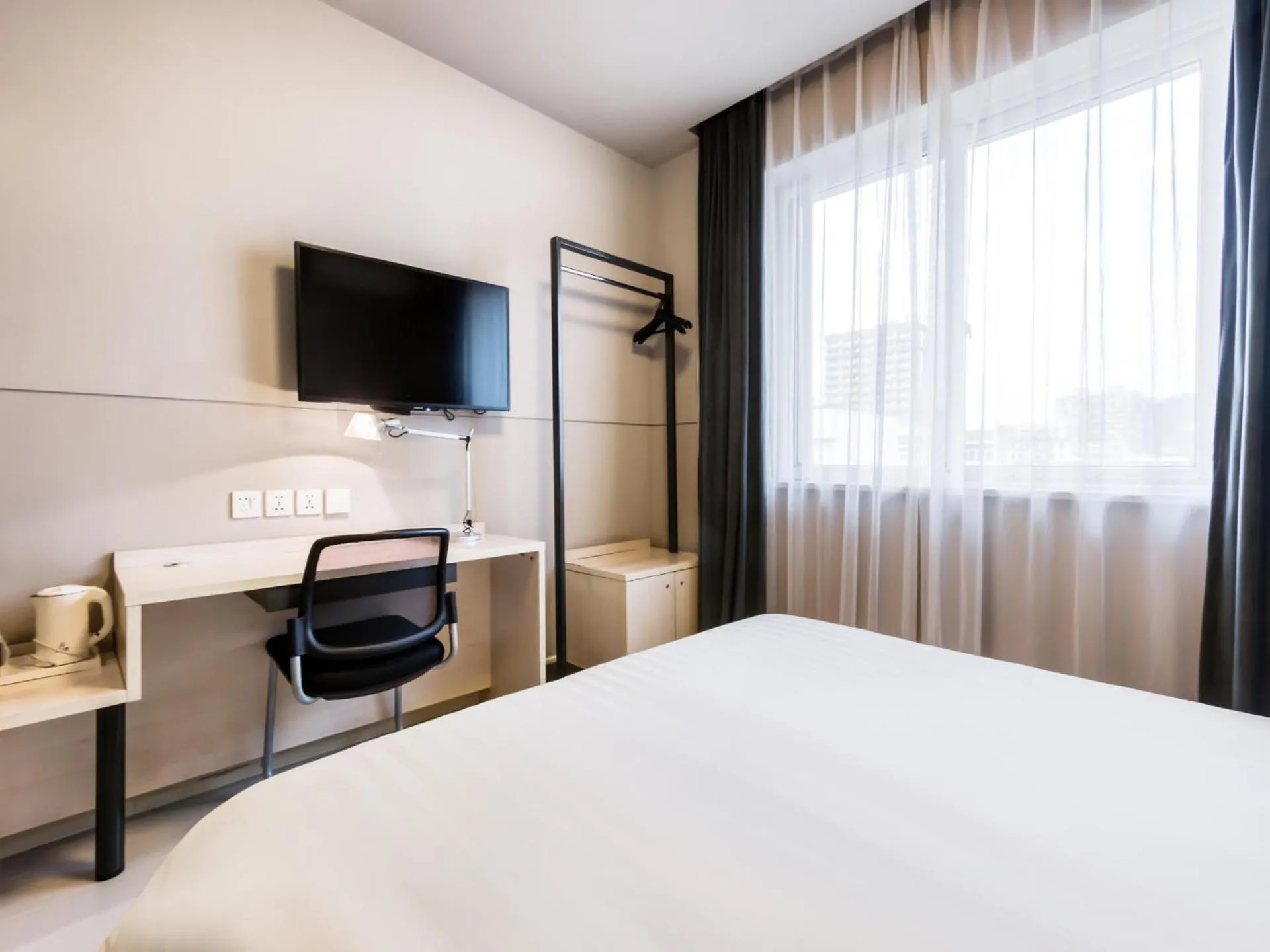 Bed in Jinjiang Inn Xinchang Gushan Road Big Buddha Temple