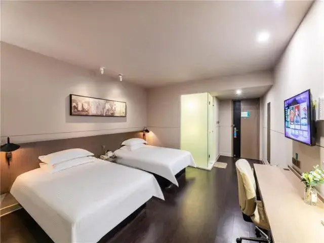 Bed in JinJiang InnSelect Suzhou Shengze Shunhuxilu Hotel Bed in JinJiang InnSelect Suzhou Shengze Shunhuxilu Hotel