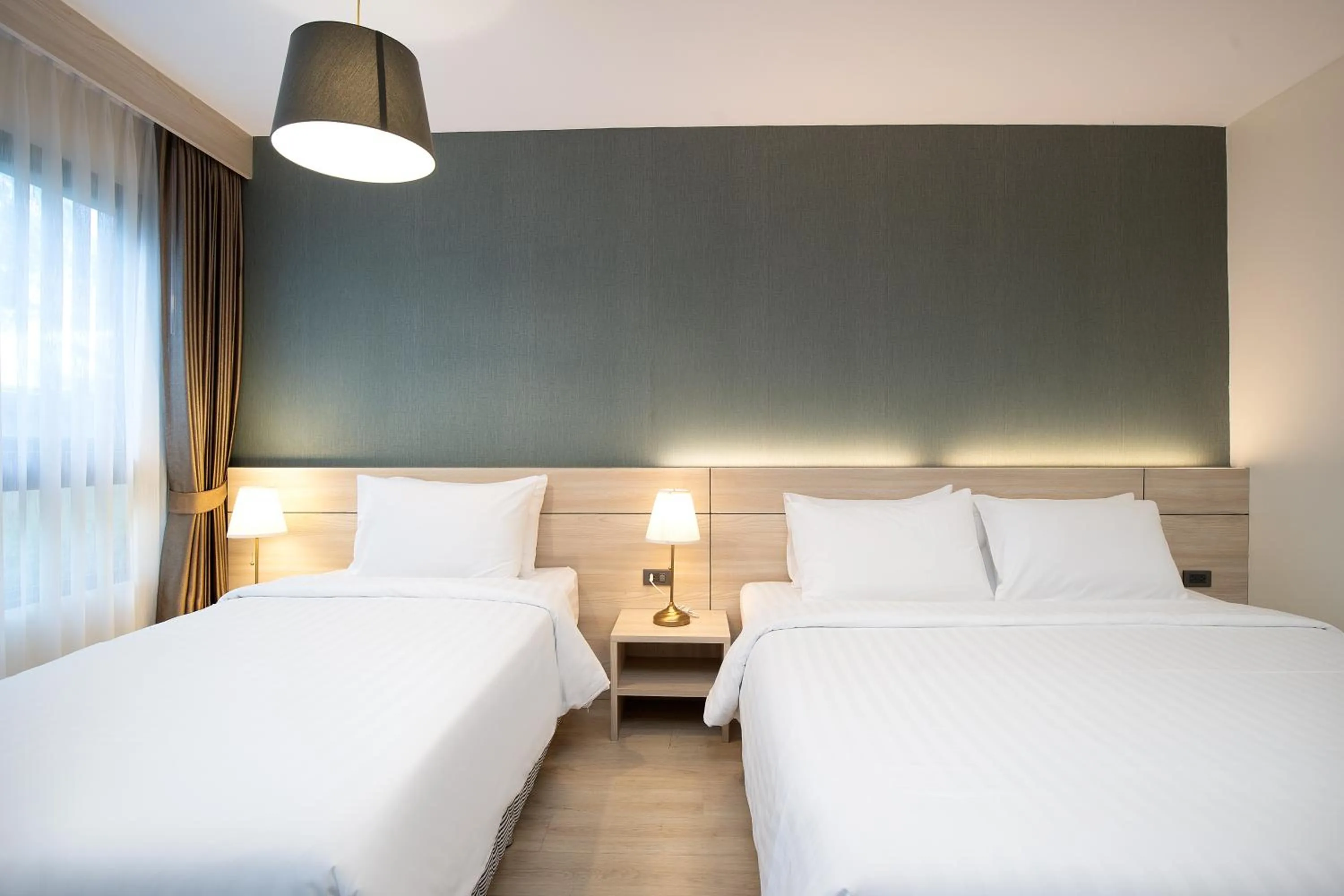 Bed in Amanah Bangkok Hotel