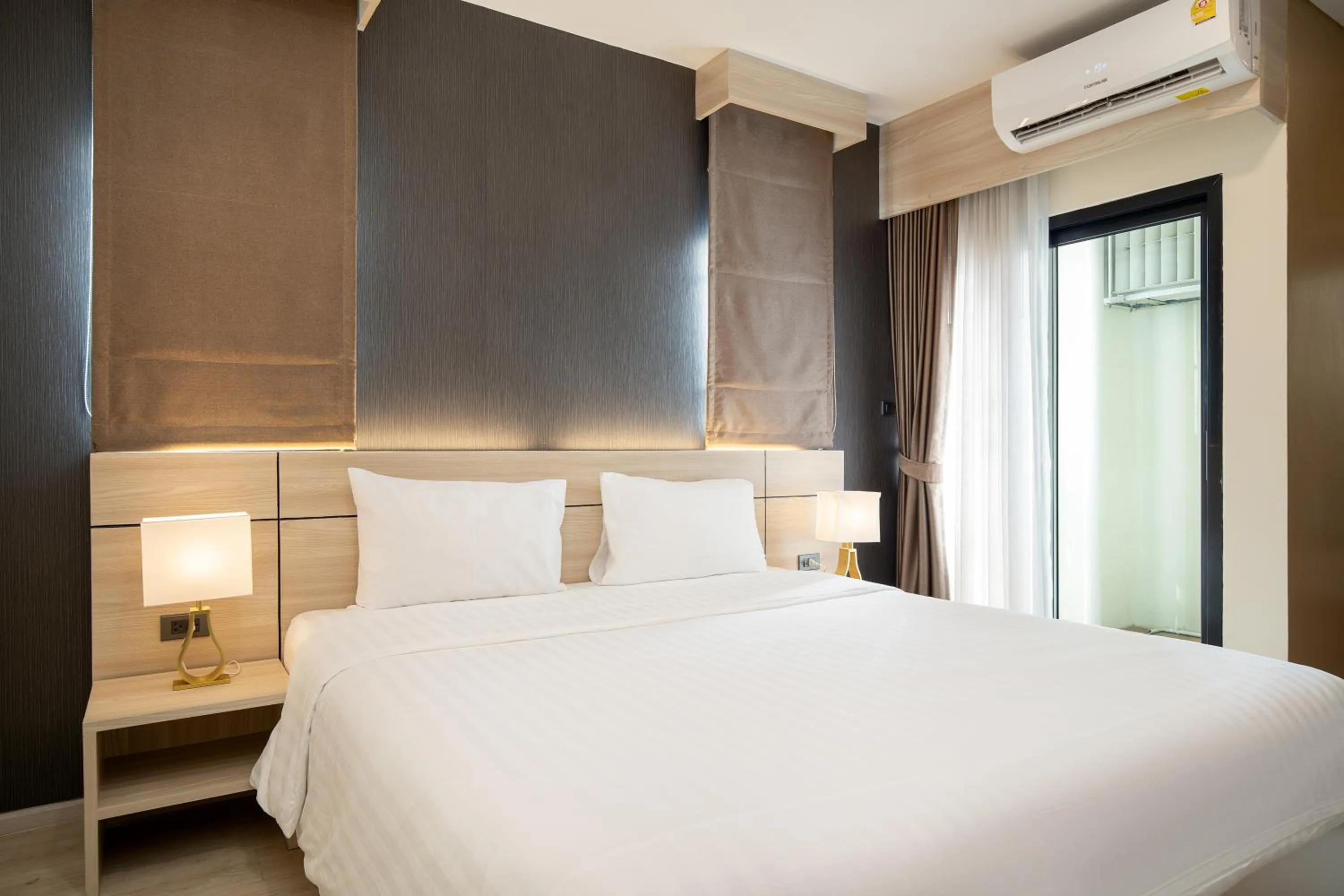 Bed in Amanah Bangkok Hotel