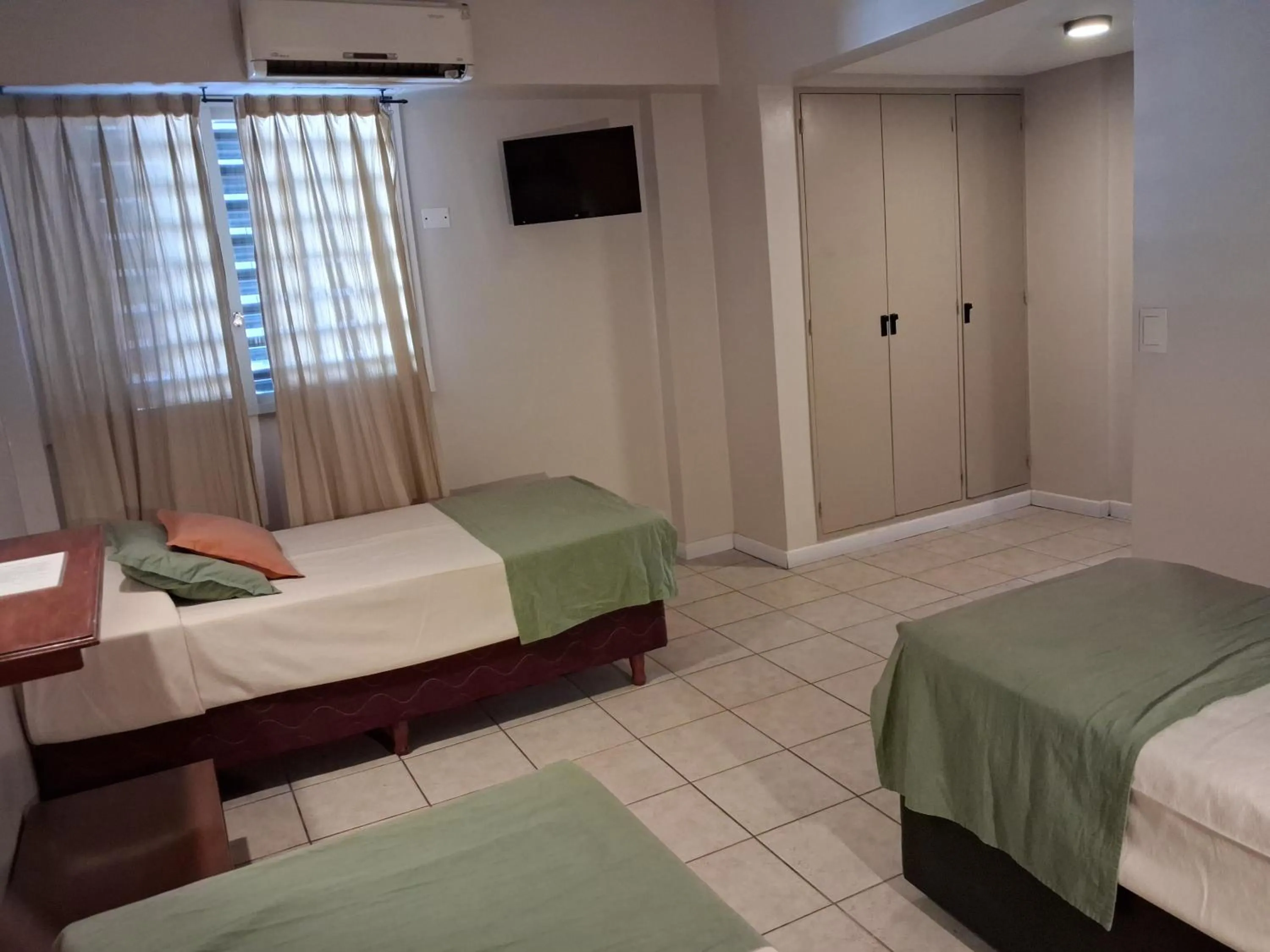 Bed in Esmeralda Palace Hotel