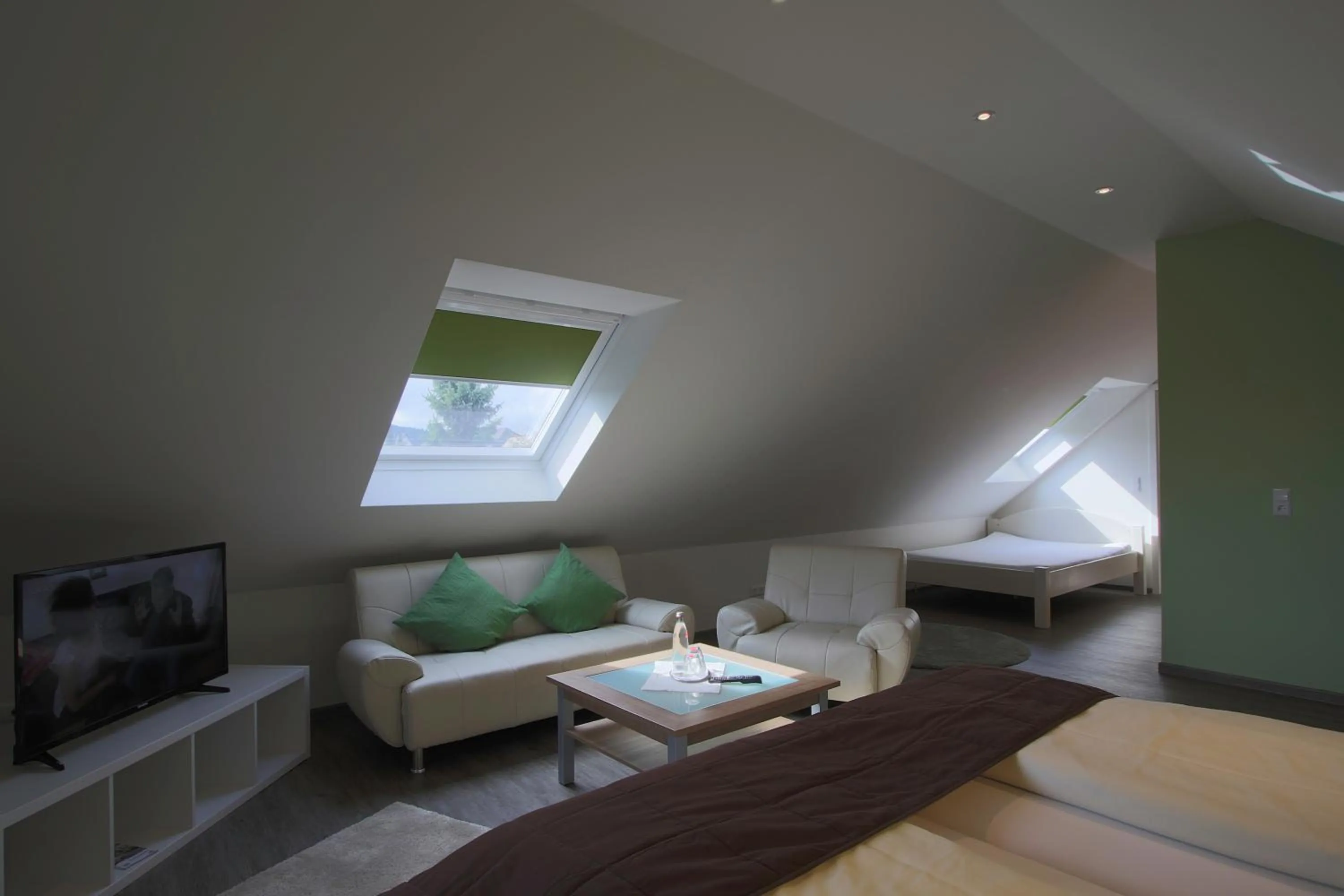 Seating area, Bed in Hotel Schneider