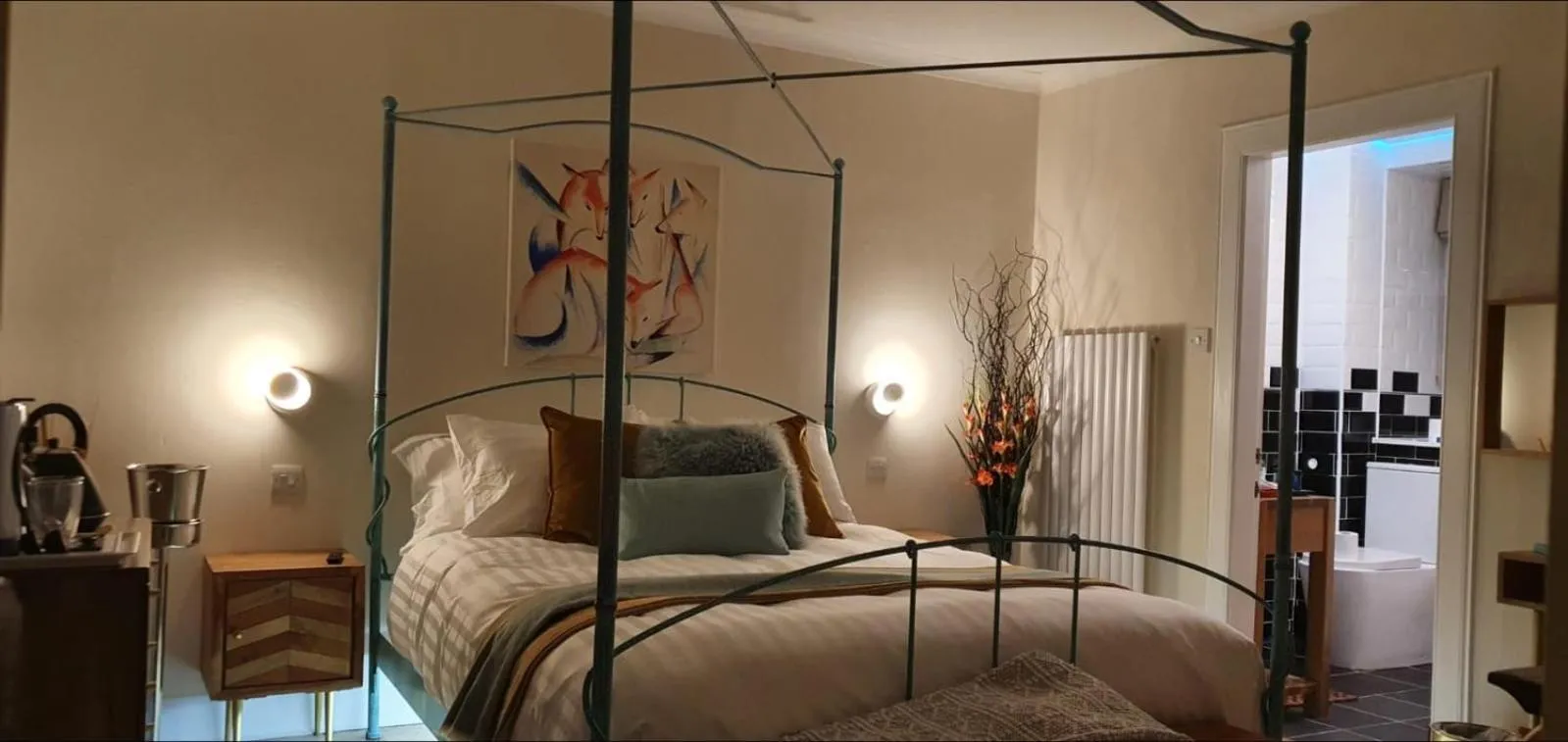 Bed in The Orange Fox Lux Room and Hot Tub at The Grumpy Schnauzer Guest House