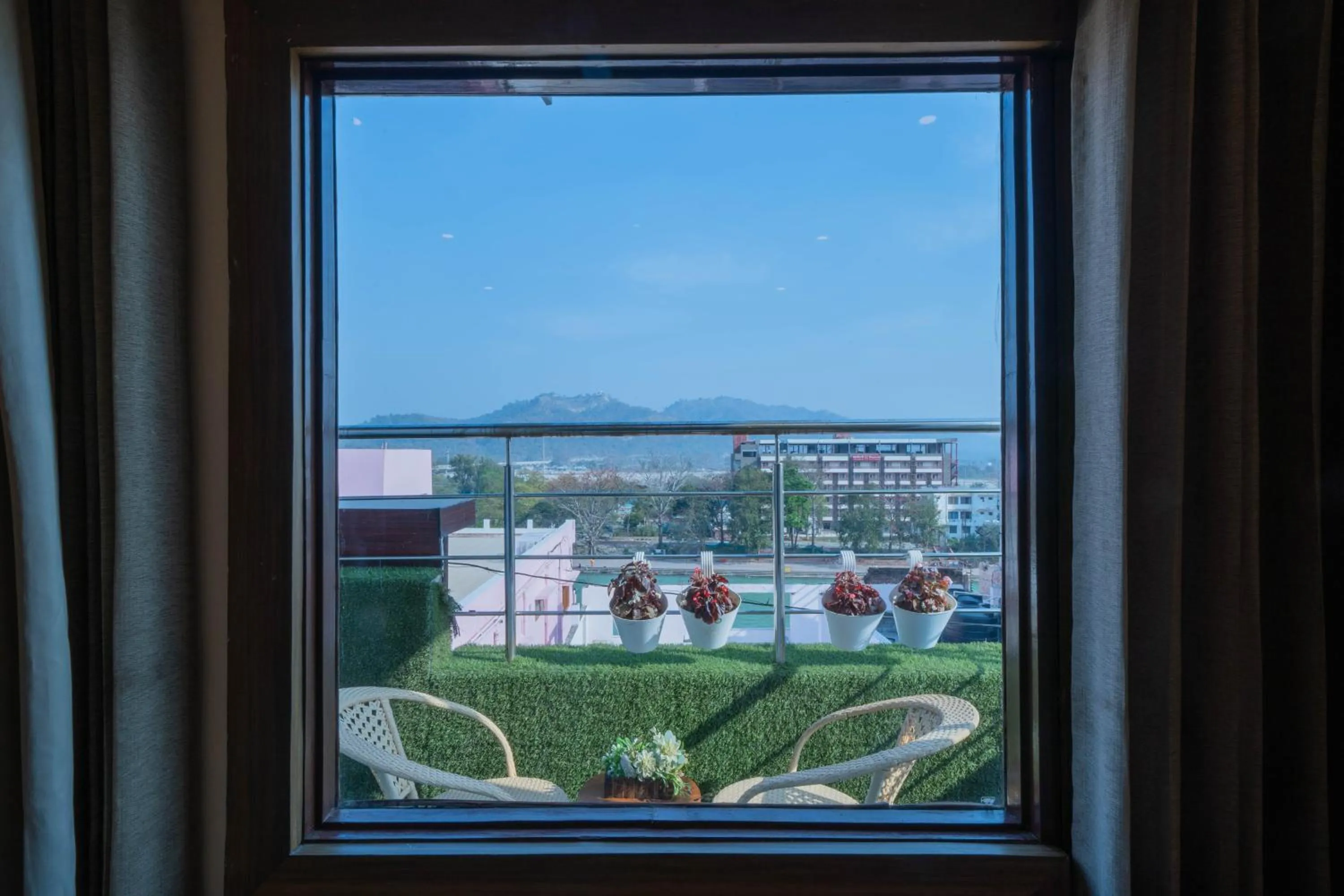 Balcony/Terrace in Perfectstayz Premium Ganga Heights - Ganga View rooftop cafe